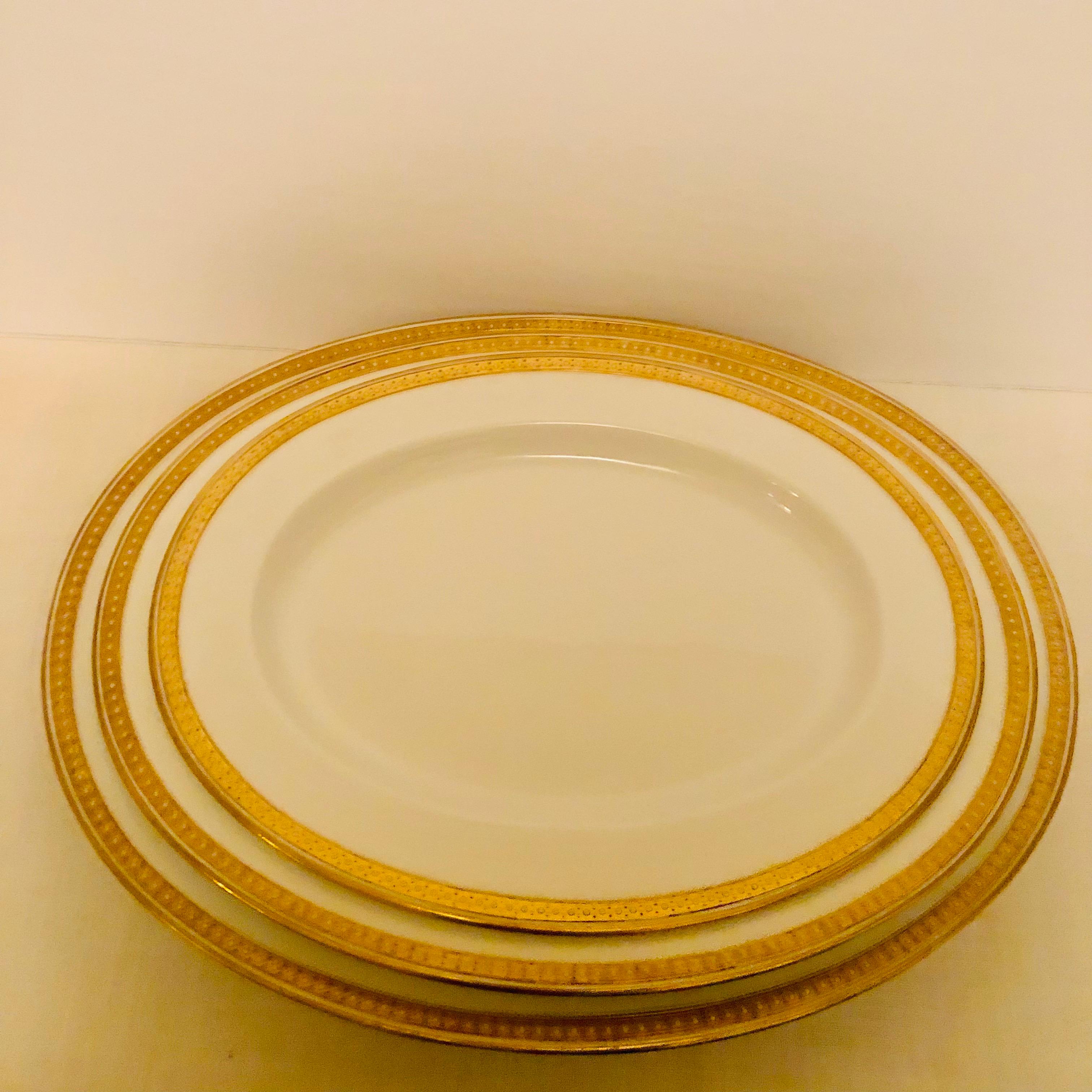 Nest of Four Spode Copeland Serving Platters With Gold Border and White Jeweling 7