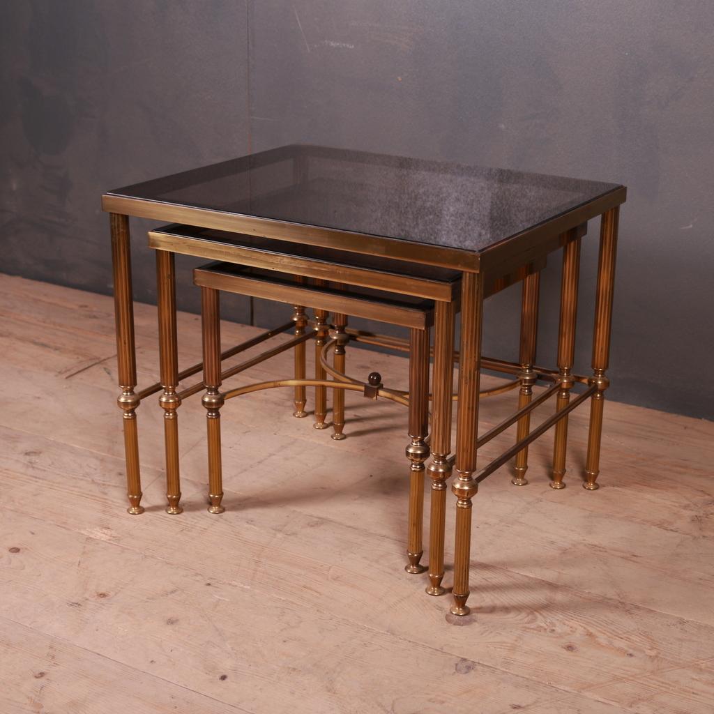 Good nest of three French brass and glass tables. 1960s.

Dimensions of smallest table:

14