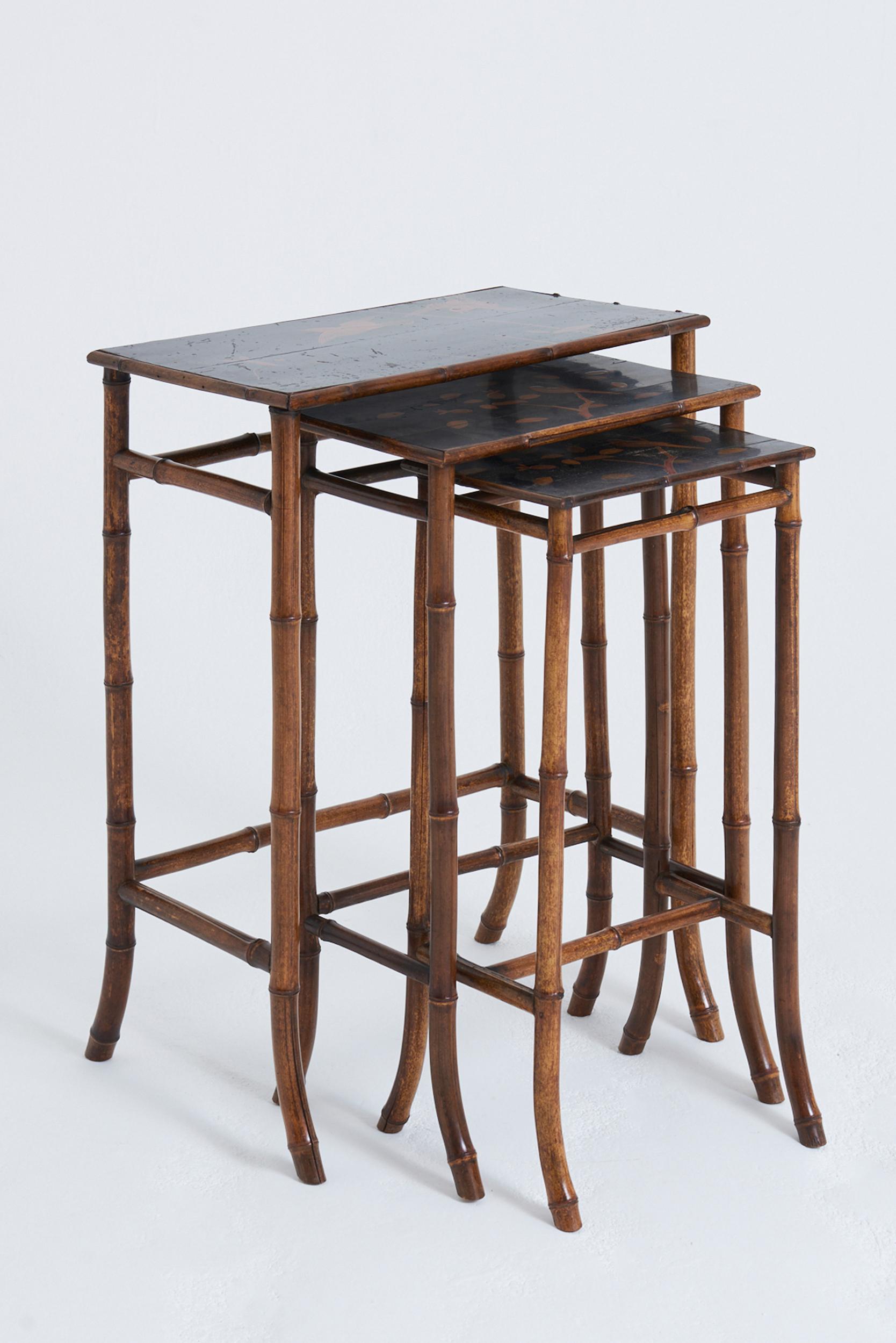 A nest of three Japanned lacquer top and bamboo tables, by Perret & Vibert, also known as La Maison des Bambous
France, Circa 1890
Table 1: 77.5 cm high by 55.5 cm wide by 38 cm depth
Table 2: 73 cm high by 42 cm wide by 32 cm depth
Table 3: 69.5 cm