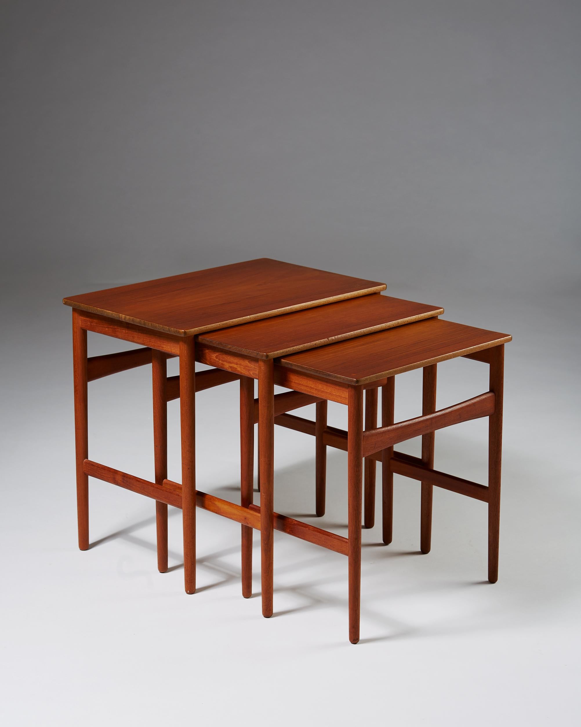 Nest of tables designed by Hans J. Wegner, 1950s. Solid teak.