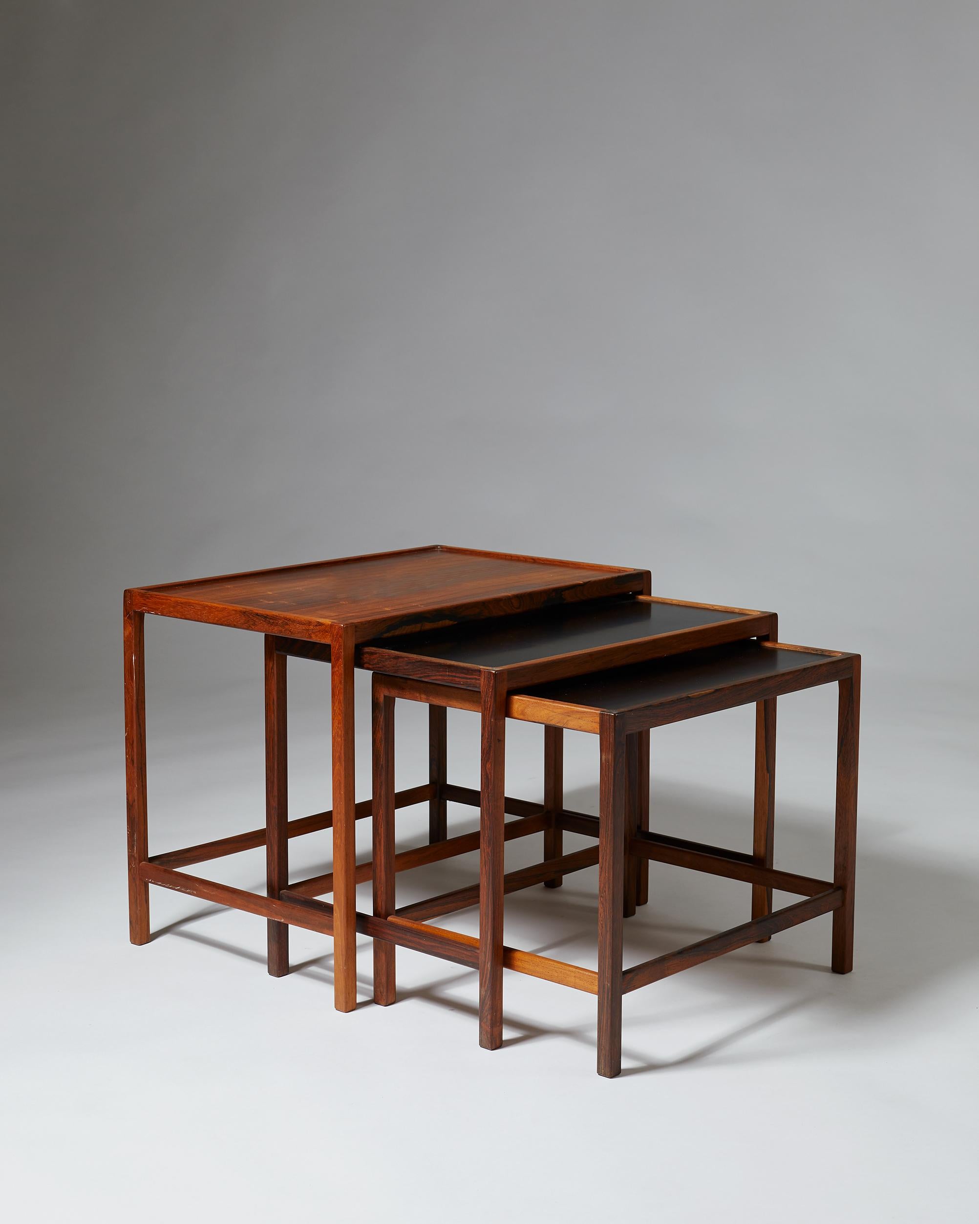 Nest of tables designed by Kurt Östervig for Jason Möbelfabrik, 
Denmark, 1960s.

Rosewood and formica.