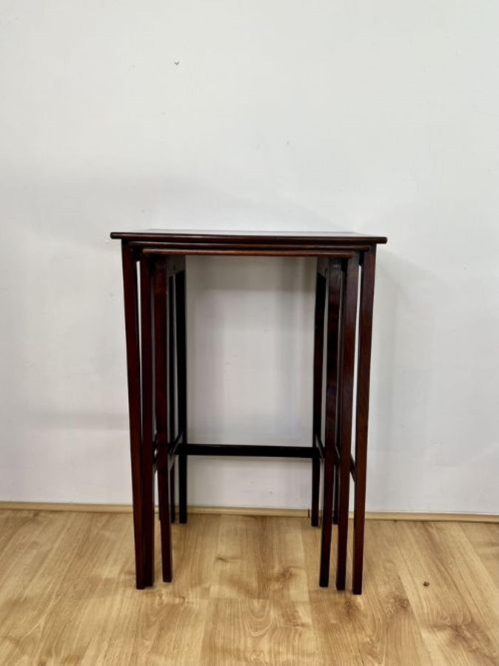 Nest of three antique Edwardian quality mahogany inlaid tables having a quality mahogany rectangular shaped top with inlaid satinwood, standing on elegant square tapering legs united by a stretcher.