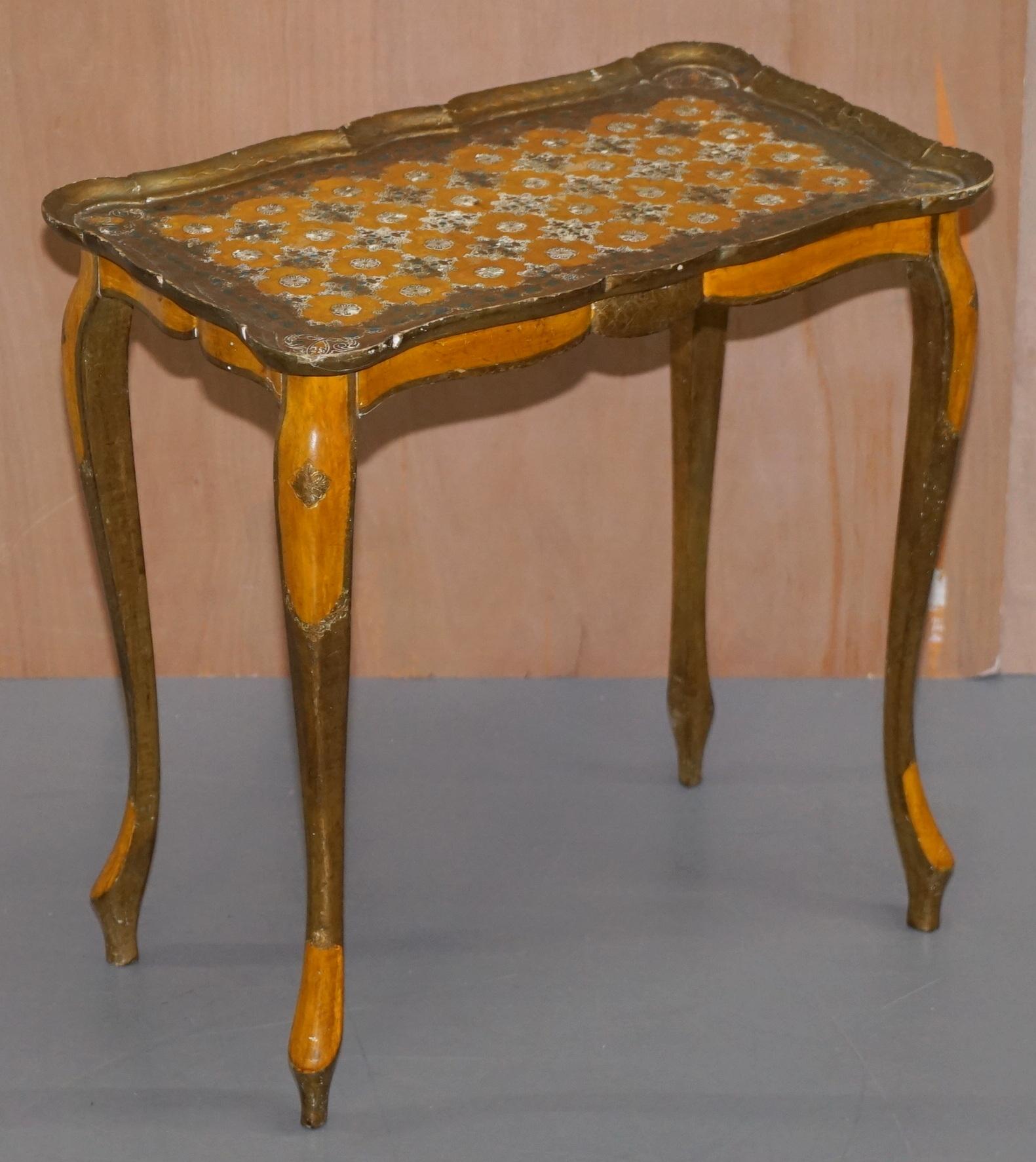 We are delighted to offer for sale this lovely hand painted made in Italy G. Serraglini Firenze stamped tables

A very good looking well made set, they are hand painted with gold leaf, the colours are rich and vibrant, they have a distressed 200