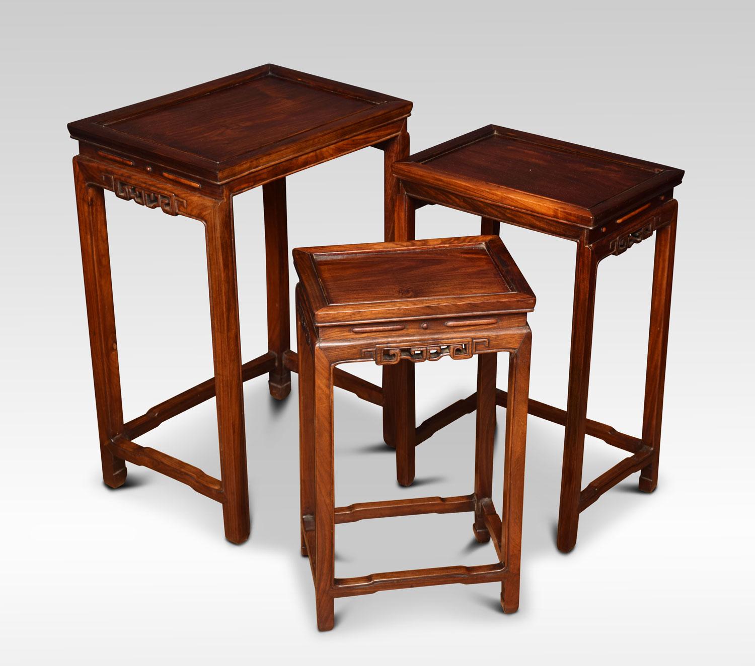 Nest of three Chinese rosewood tables, each with a recessed panel to the rectangular top and a carved frieze on four slender supports with conforming stretchers.
Dimensions
Height 24 inches
Width 16.5 inches
Depth 12 inches.