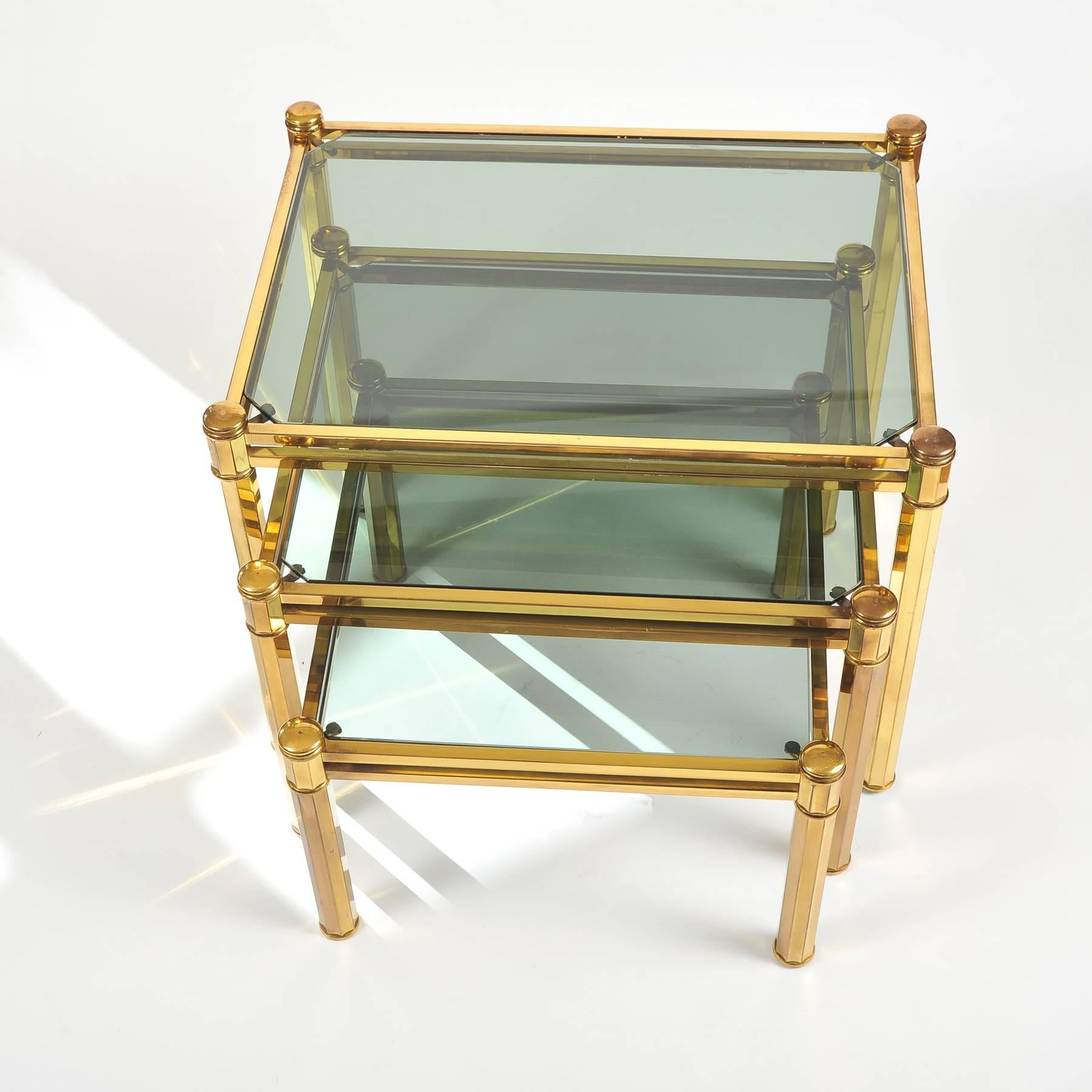 Mid-Century Modern Nest of three Italian Brass Side Tables with lightly smoked glass tops, 1960 For Sale