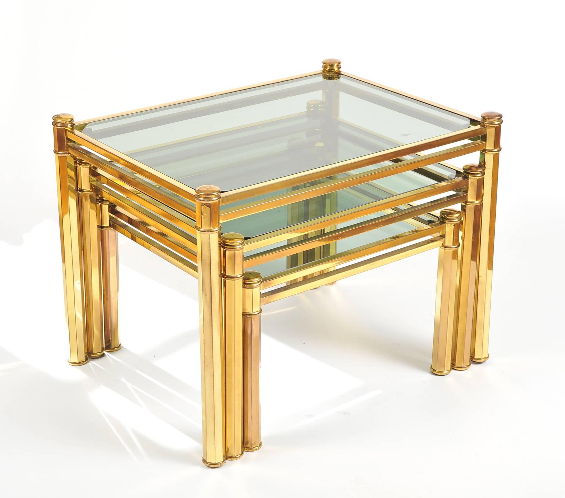 Nest of three Italian Brass Side Tables with lightly smoked glass tops, 1960 In Good Condition For Sale In London, GB
