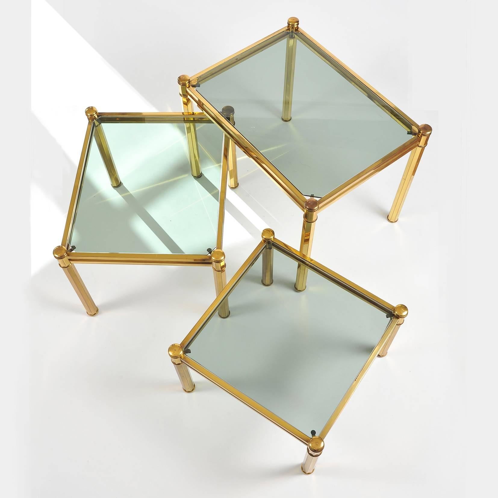 Mid-20th Century Nest of three Italian Brass Side Tables with lightly smoked glass tops, 1960 For Sale