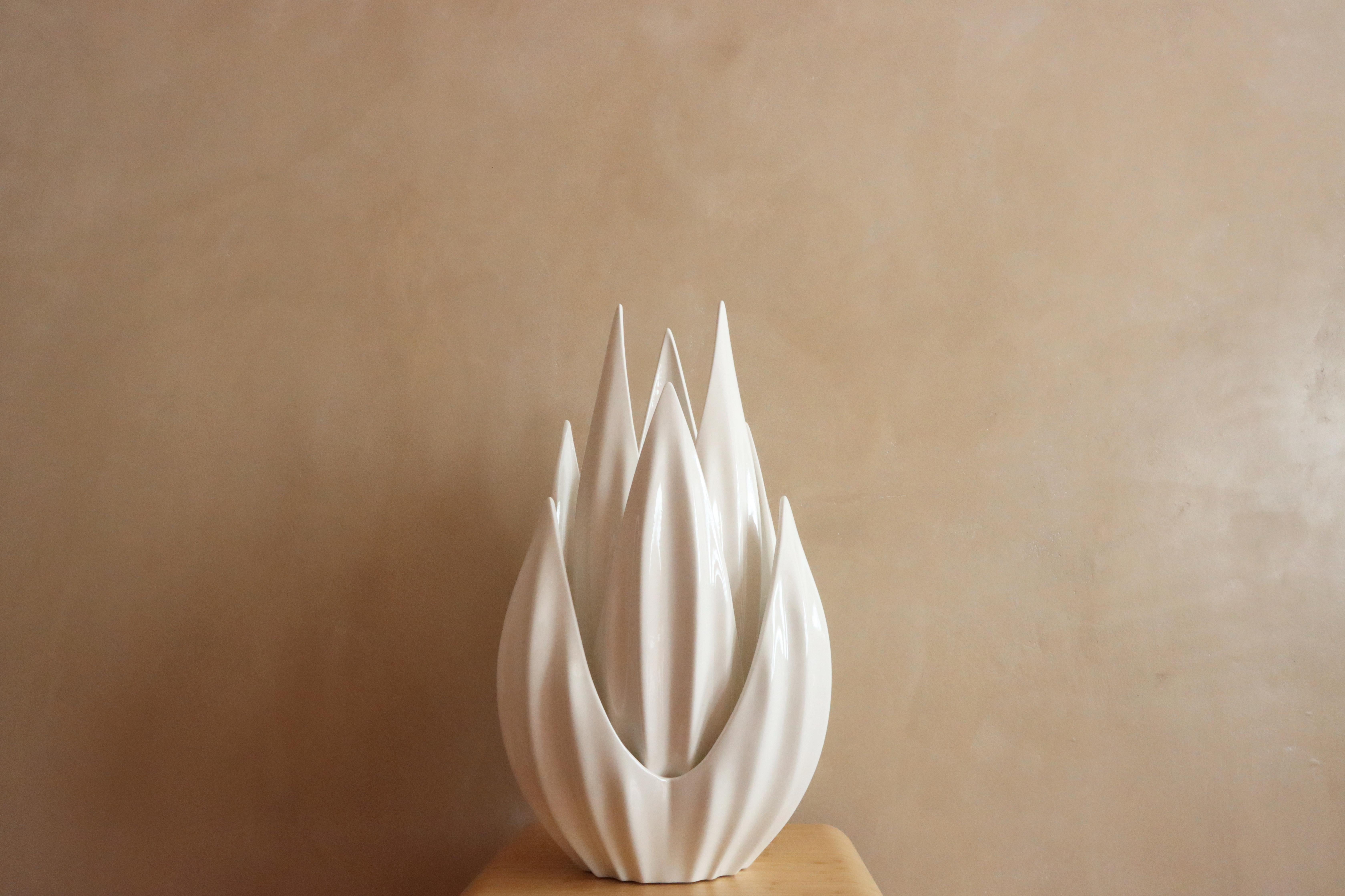 The Nested Petals consist of three exquisite vessels that can be showcased individually or grouped together, radiating an aura of timeless elegance wherever they are placed. Crafted with the utmost care, these porcelain marvels serve multiple