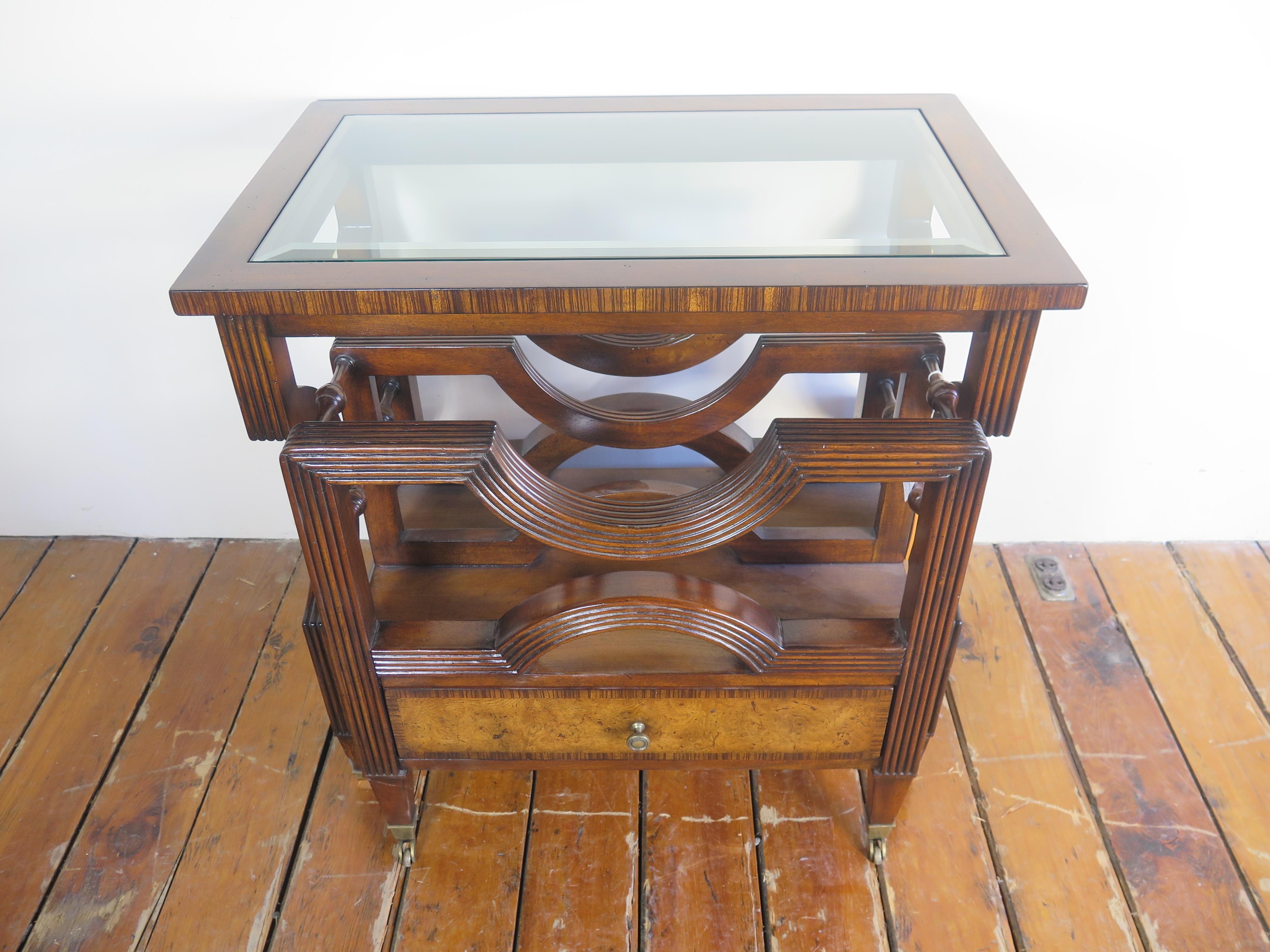 Nesting bookrack canterbury table with glass top inlay.