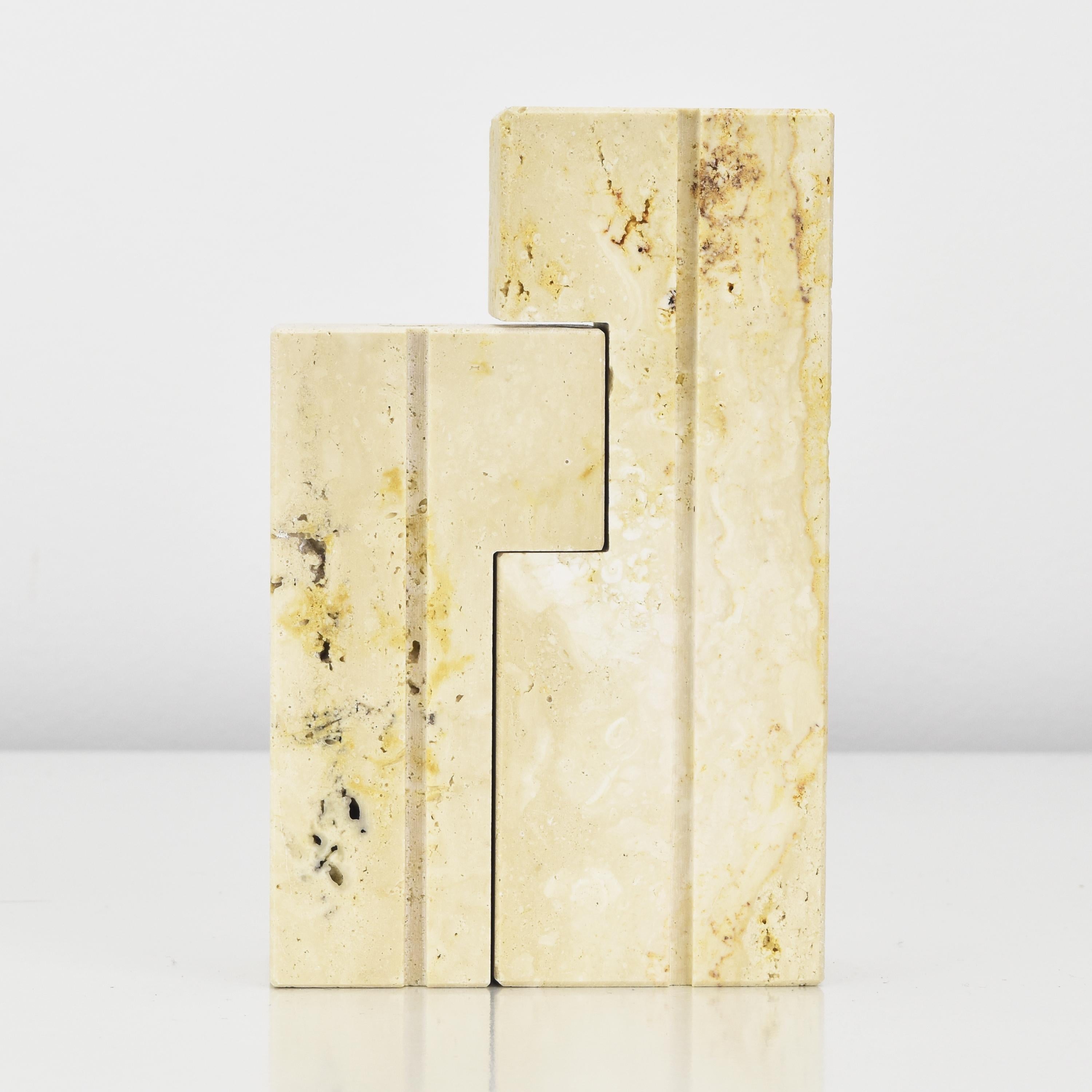 The vintage Fratelli Mannelli travertine nesting candle holders are exquisite examples of Italian craftsmanship and design. Fratelli Mannelli is a renowned Italian company known for its high-quality stone and marble products, and these nesting