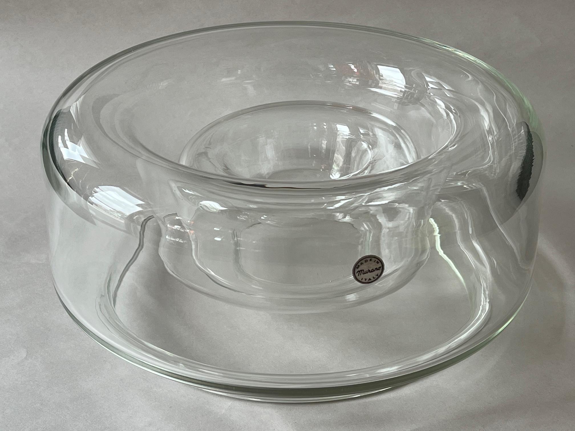 Two nesting clear glass bowls made in Murano Italy for Knoll International and designed by Charles Pfister, ca' 1970's. The large one is approx. 11.5