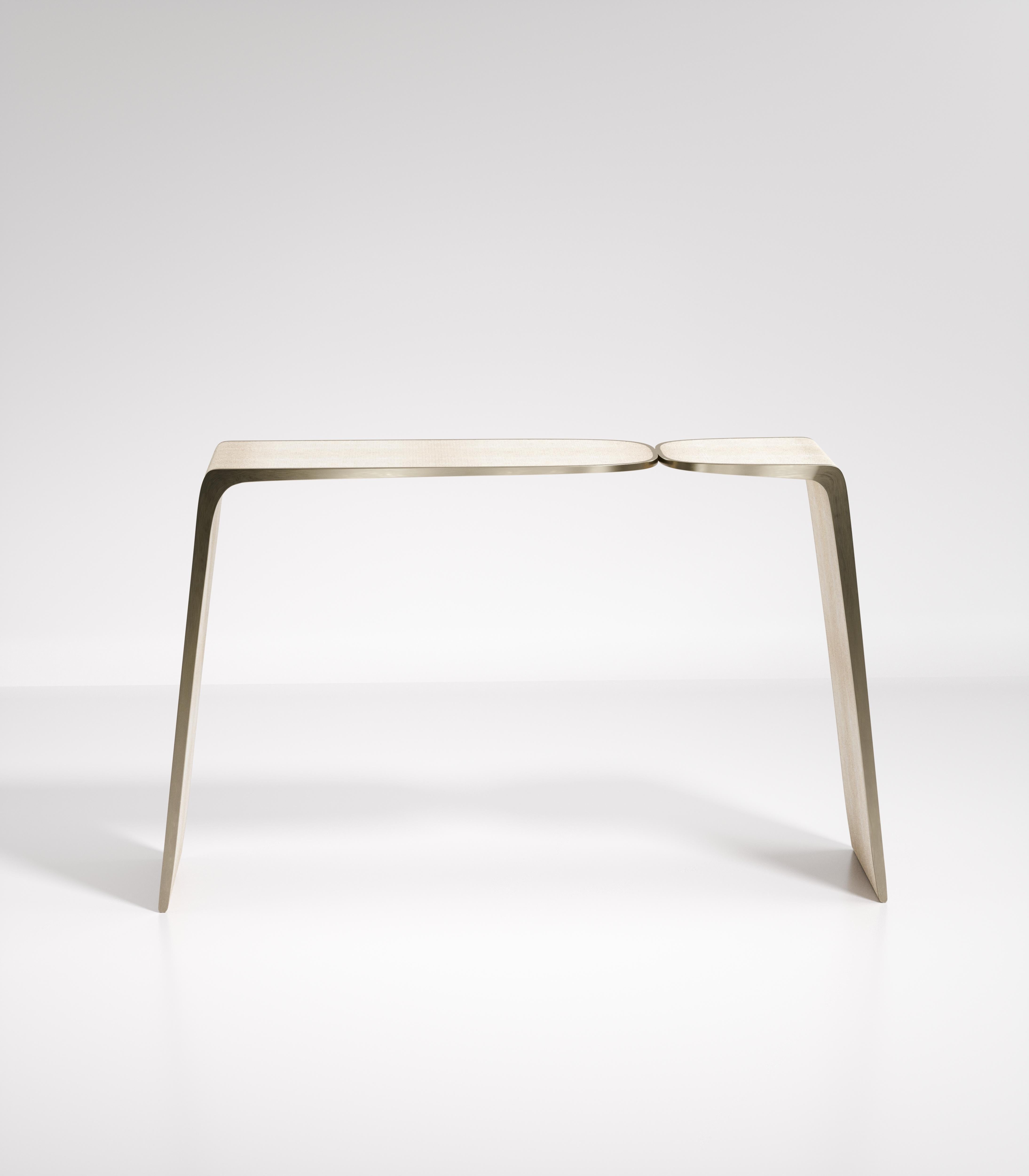 The Kiss console by Kifu Paris is an elegant and organic piece in it's unique design. The cream shagreen inlaid piece curves inwards to create the 