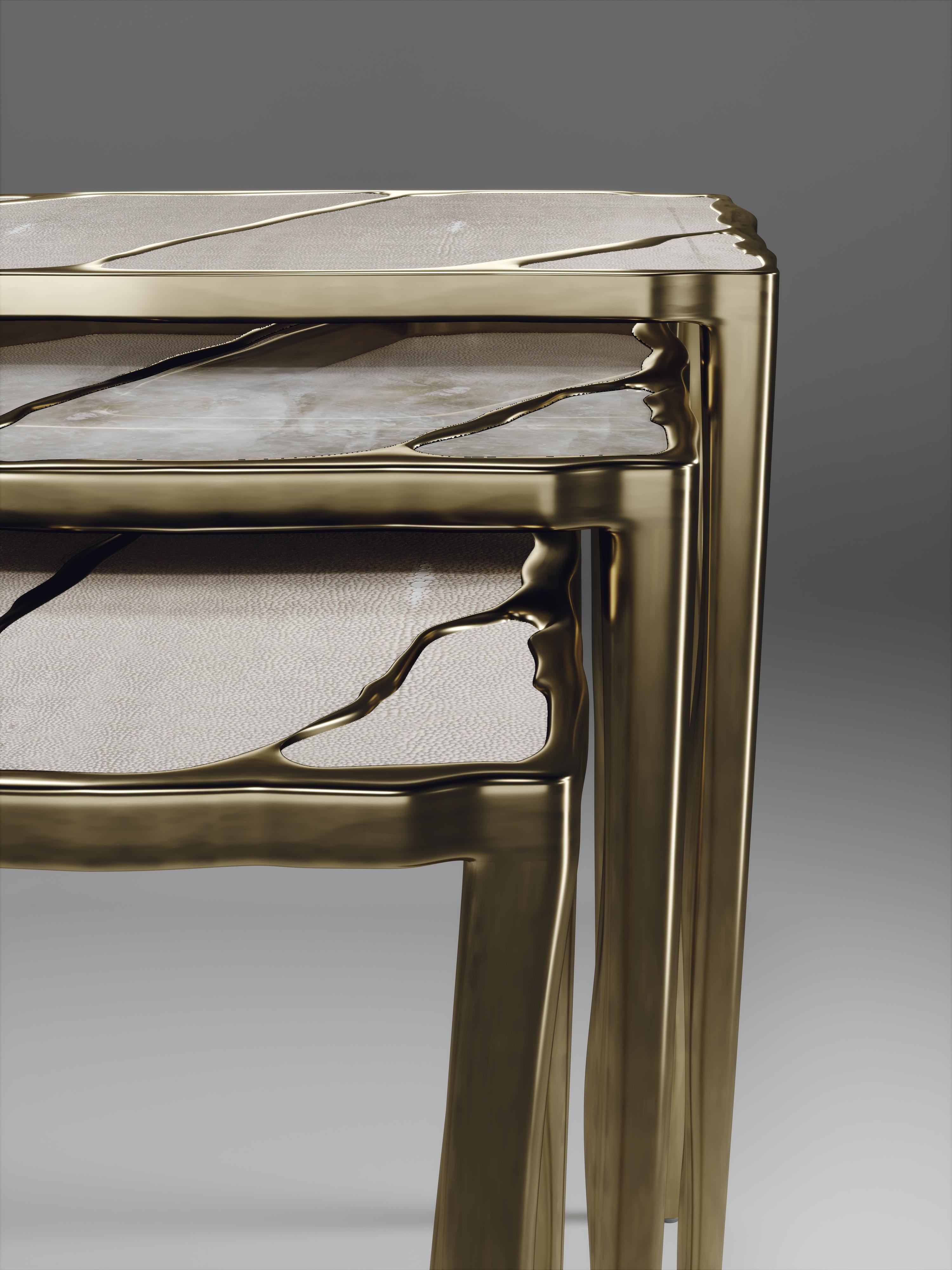 The set of 3 melting II nesting side tables, are the perfect accent pieces for any living space. These are sold as a set of 3 to create elegant and geometric shapes, but one can purchase the tables on their own. The large and small size are inlaid