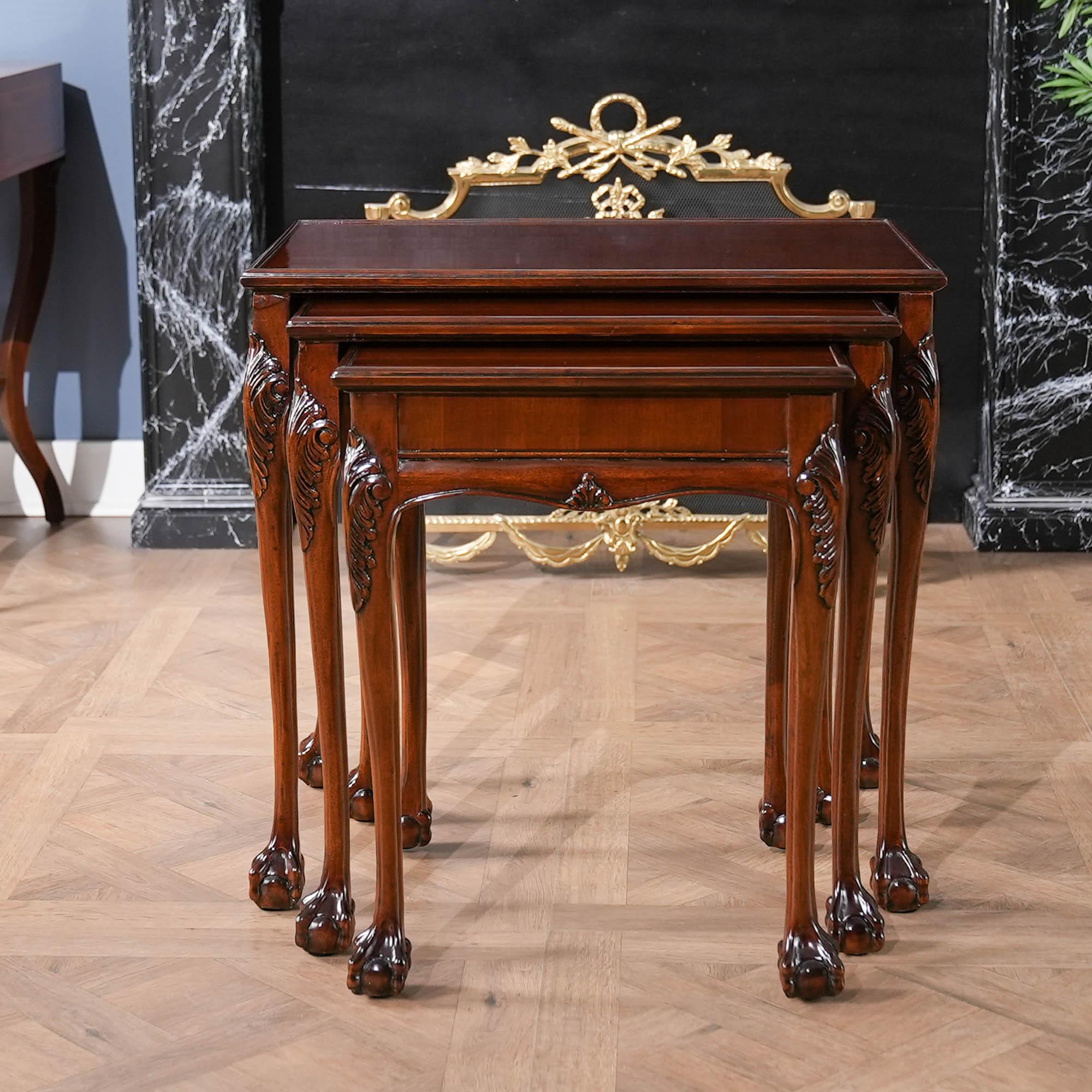 The Chippendale Nesting Table from Niagara Furniture features three tables, all with attractive mahogany tops surrounded by a lovely molding which helps prevent items sliding off  of the tables. Supported on hand carved, solid mahogany legs the