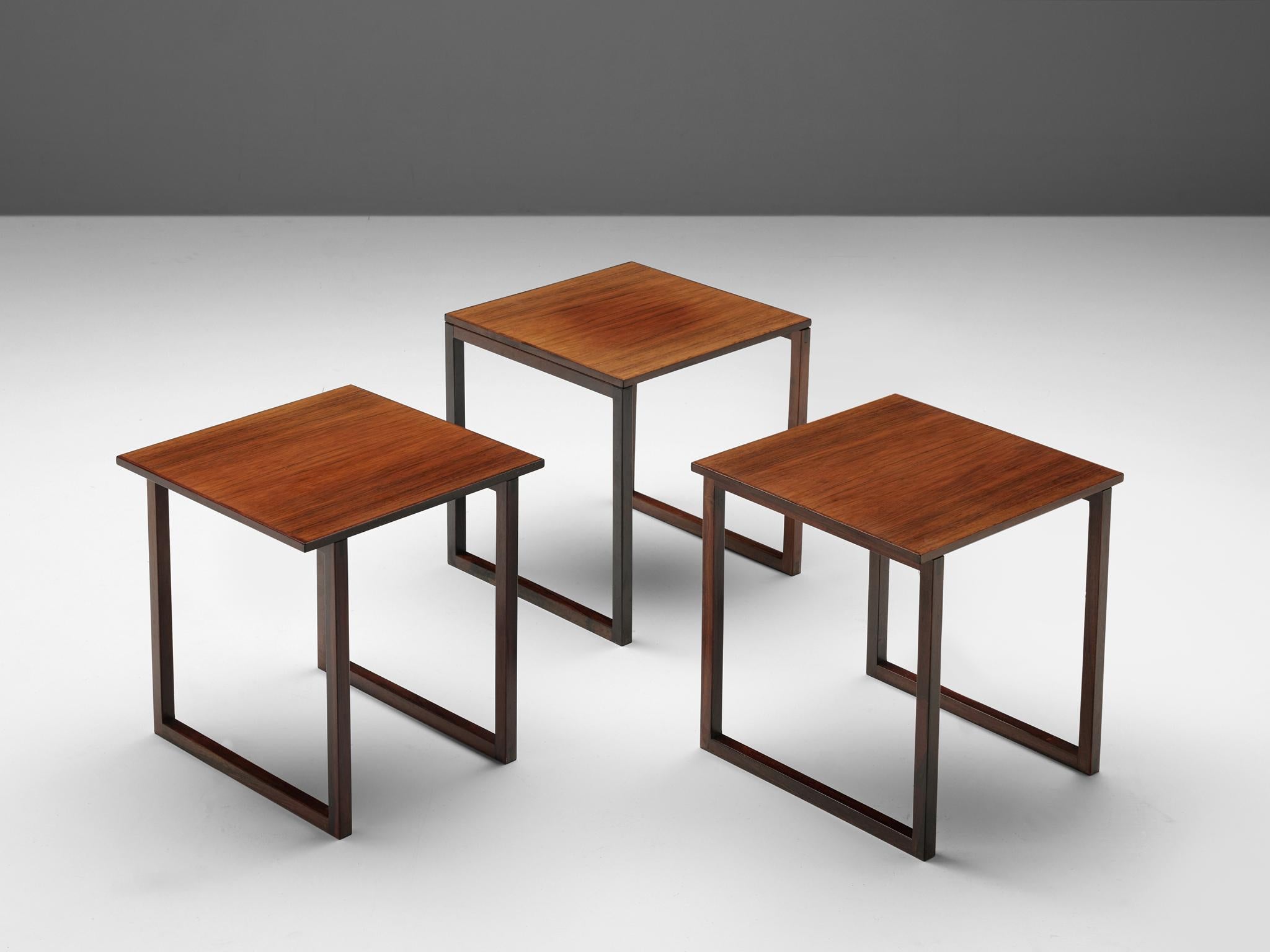 Nesting table, rosewood, Netherlands, 1960s.

These clean, modest and simple nesting tables feature rectangular tops and legs. The design is very clean, both in its aesthetics as in its construction. The rectangular top has a nice small trim which