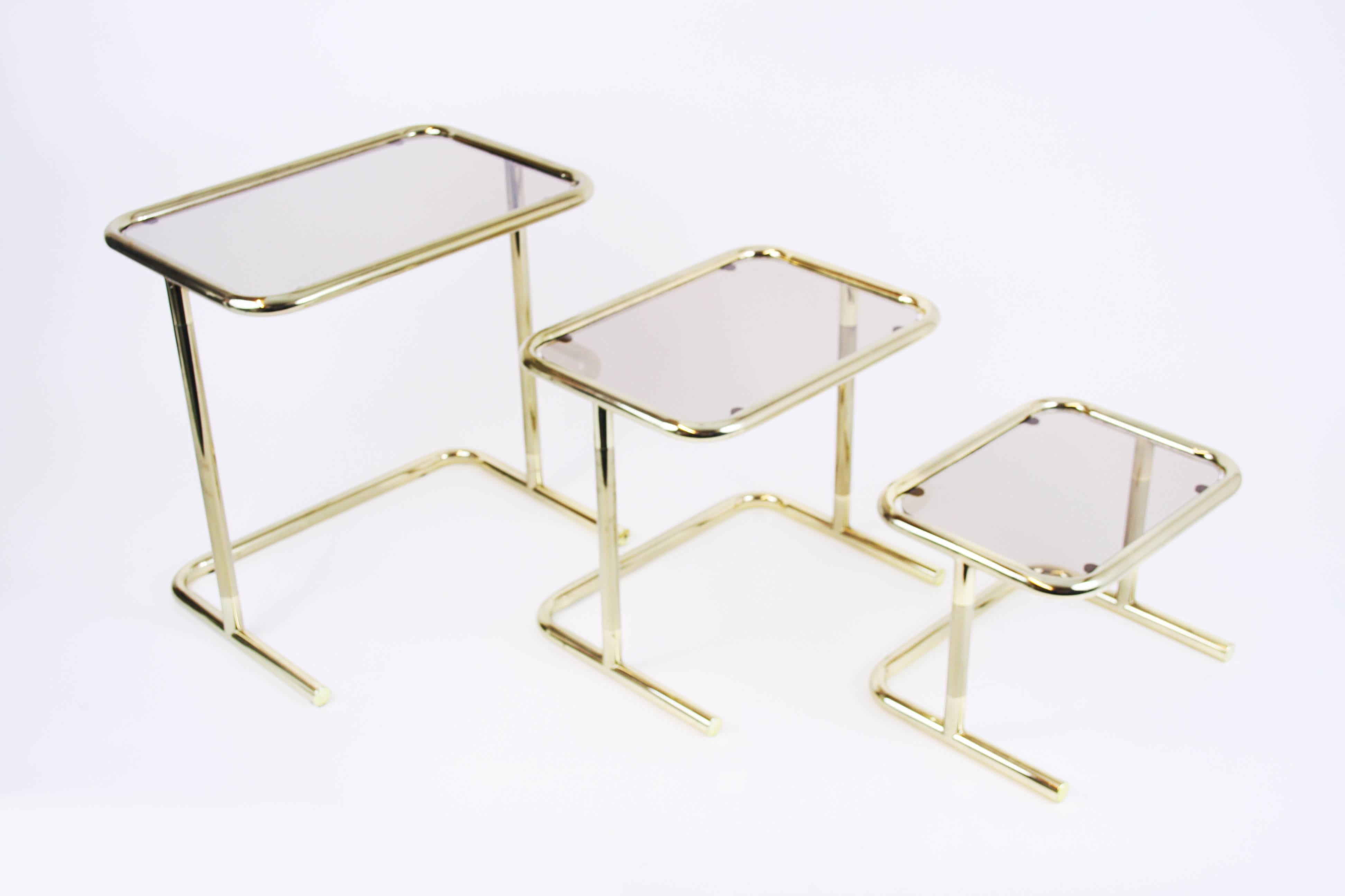 Gilt Nesting Table Set Attributed to Design Pierre Cardin, Brass Smoked Glass, France For Sale