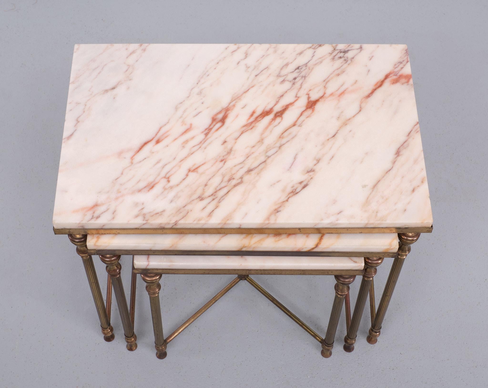 Very nice set of nesting tables. Patinated Brass frame ,comes with 
Marble tops . lots of Pink color in the Marble .  so stylish.  

Please don't hesitate to reach out for alternative shipping 