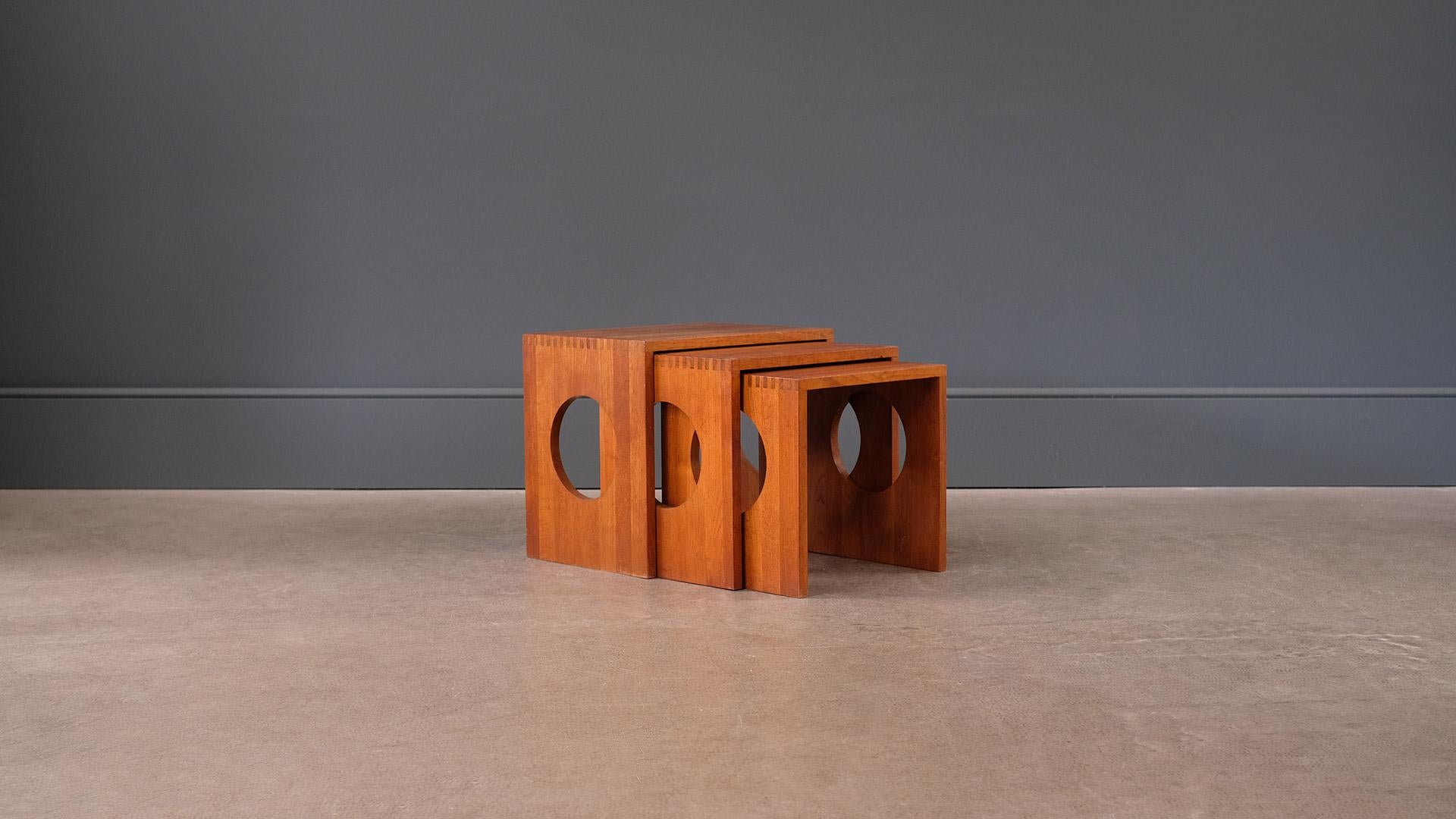 Super rare set of very sought after nesting tables designed by Jens Quistgaard for Nissen, Denmark. Beautifully made in solid Burmese teak with feature exposed joint details. Wonderful set.