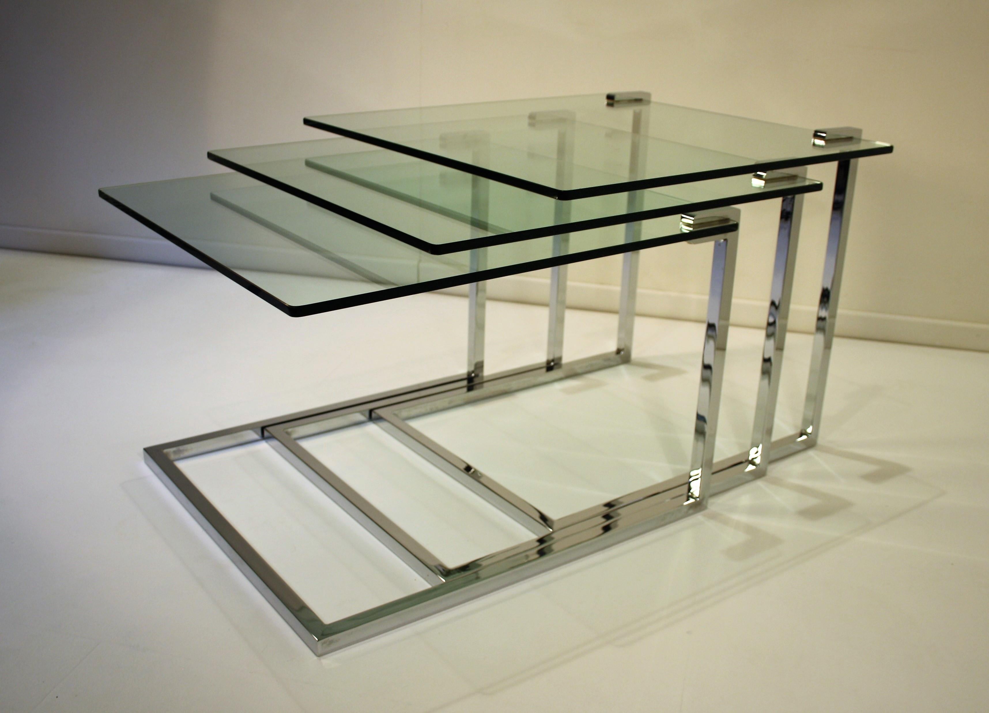 Three beautiful modernistic nesting Tables from the 1970s in chrome, each with a thick glass plate.
What is very apart is that all the glass plates have the same sizes.
The work of this design is comparable to Romeo Rega and Willy Rizzo.