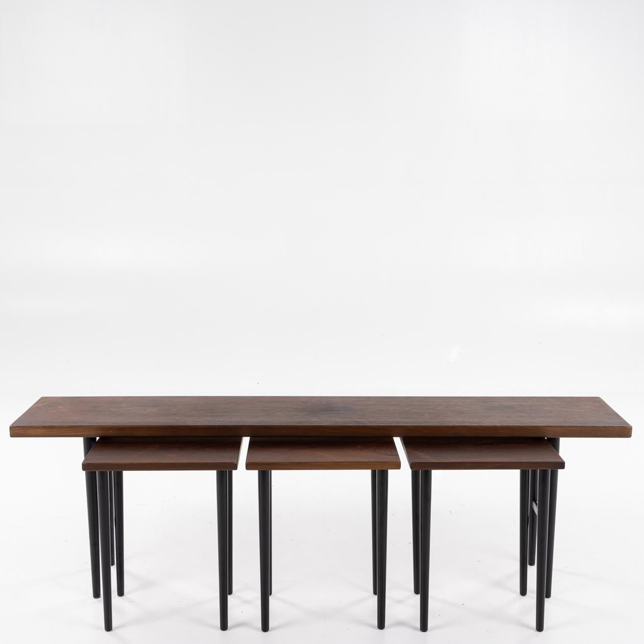 Nesting tables in Brazilian rosewood and black-painted legs. Four pieces. Kurt Østervig / Jason Møbler Ringsted