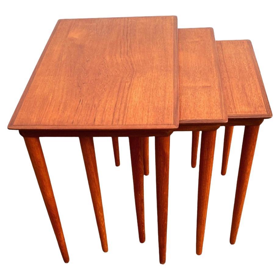 Elegant set of nesting tables by Danish furniture manufacturer. Designed and produced in 1960s. Solid teak. Measures are the largest of the tables.

The tables are inspired and resembles nesting tables designed by Hans J. Wegner and Johannes