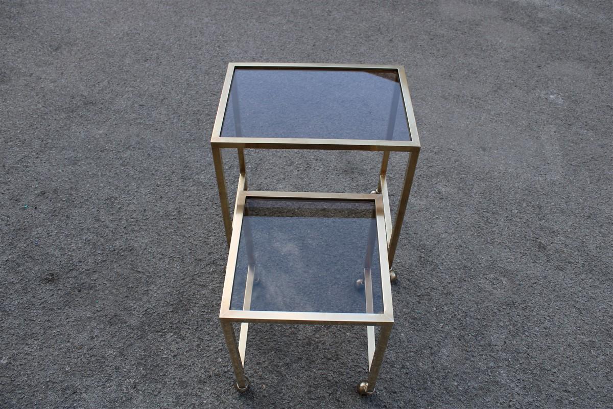 Nesting tables Italian design 1970 in solid brass with wheels.
Large height 53 cm, width 47.5 cm, depth 33 cm.
Small height 41 cm, width 34 cm, depth 34 cm.