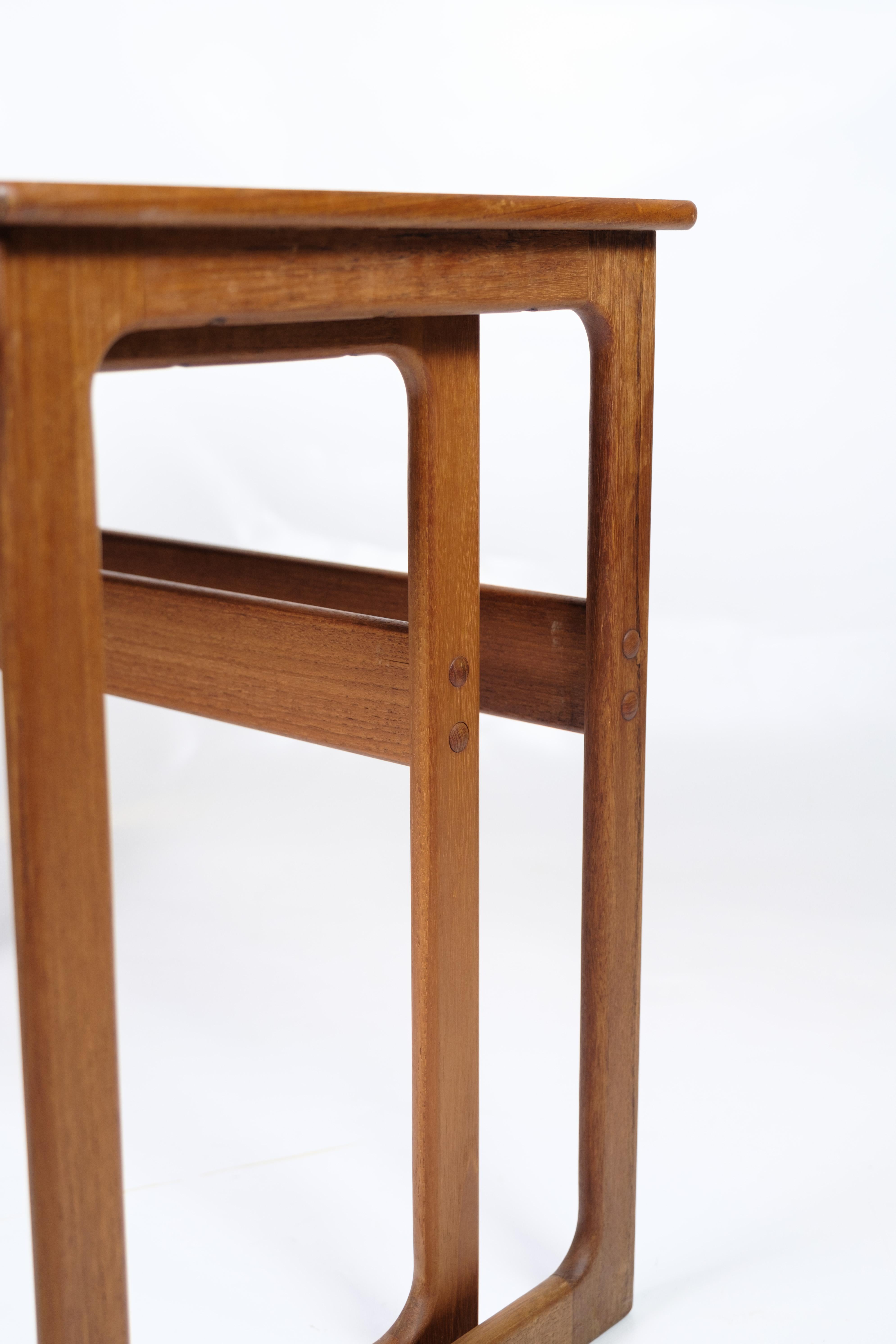 Set of 2 nesting tables, model 219, made of teak and designed by Johannes Andersen & Illum Wikkelsø, manufactured by CFC Silkeborg in the 1960s. The tables are characterized by their simple and functional design with beautiful details, such as the