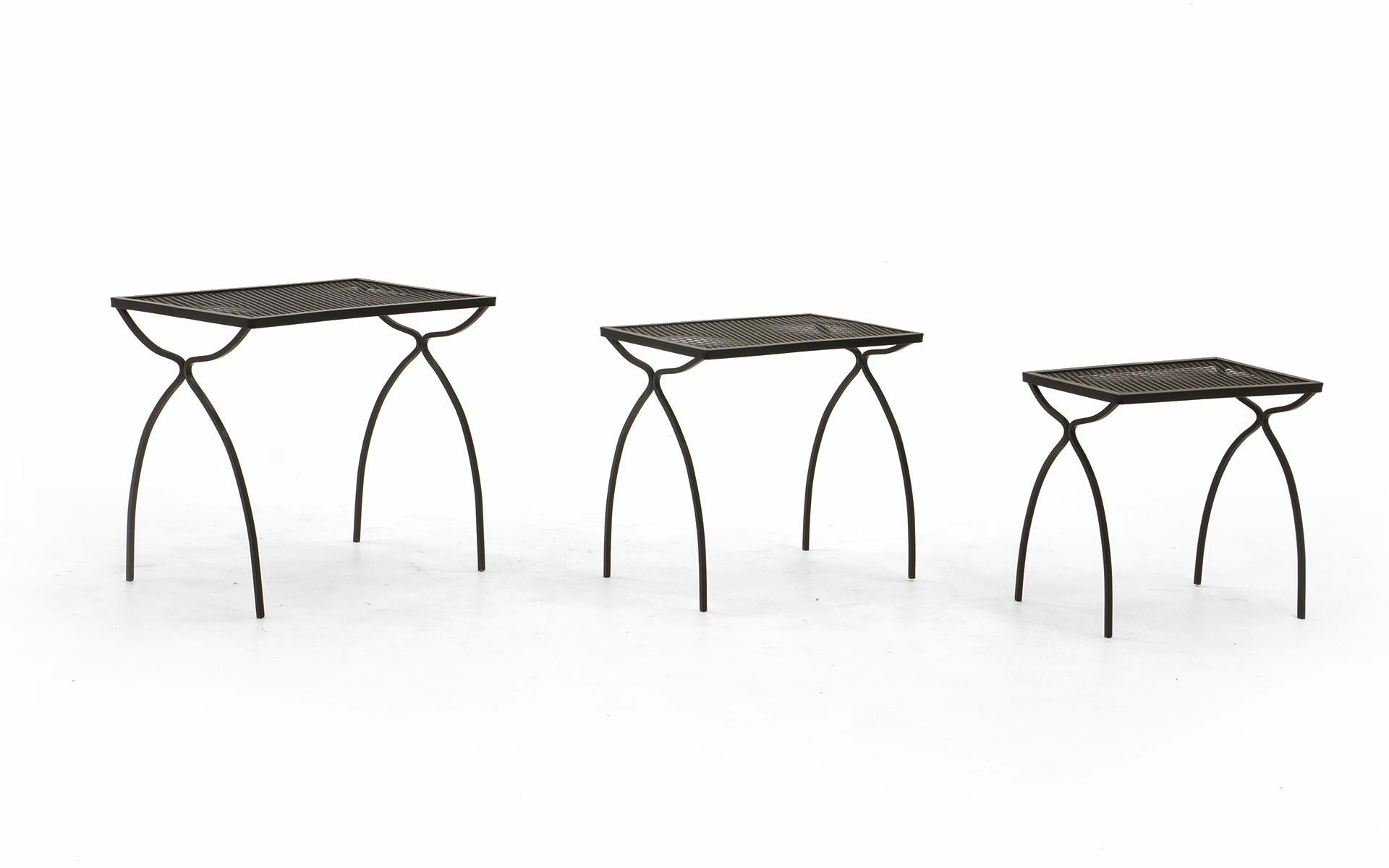Set of three wrought iron and steel nesting tables by the John Salterini Company, 1960s. Professionally media blasted and powder coated in a satin black finish.
Measurements
Small: 15.5 in. H x 16.5 in. W x 10.5 in. D
Medium: 17 in. H x 18.25 in. W