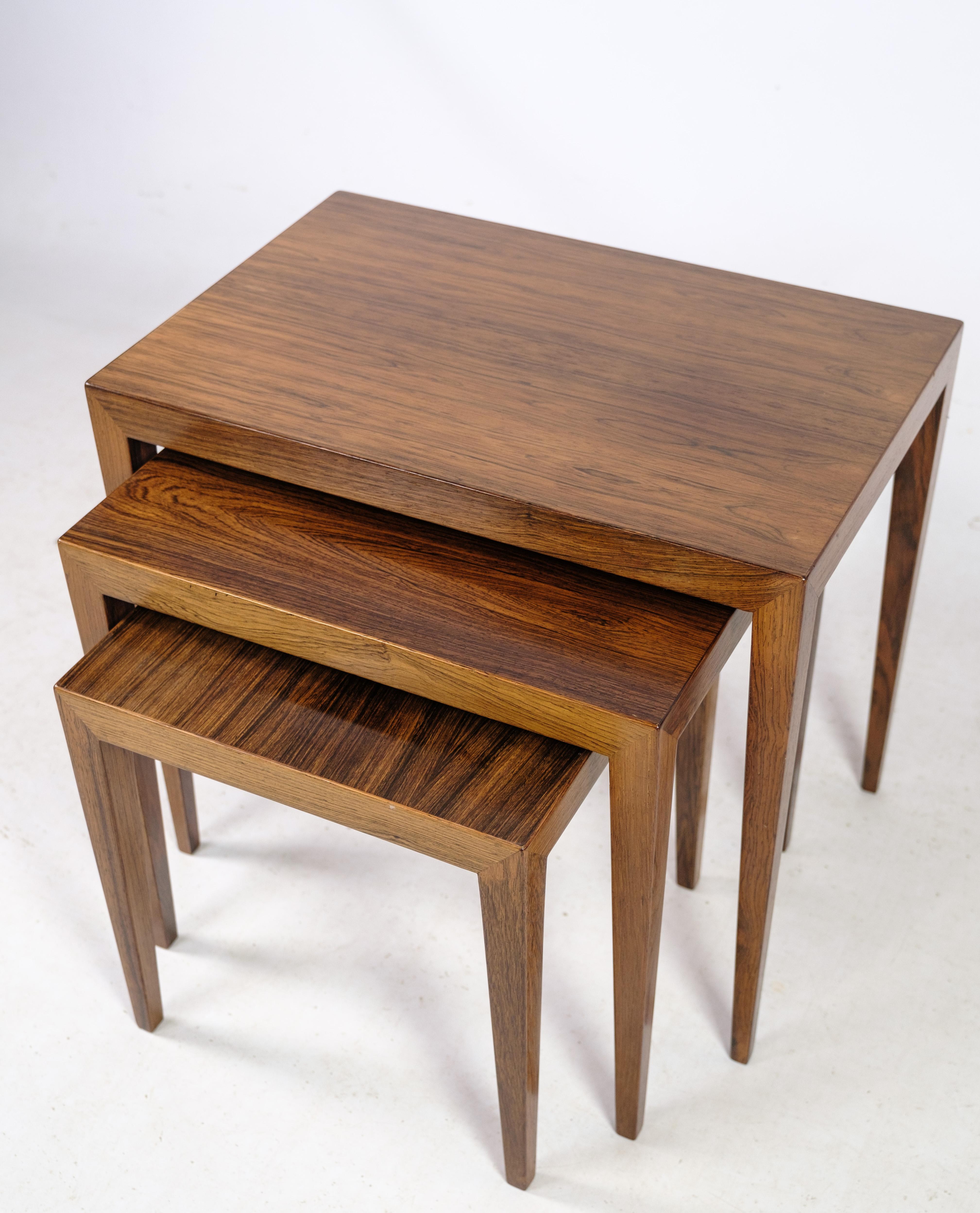 These nesting tables, designed by Severin Hansen and crafted from rosewood, offer a timeless blend of elegance and functionality. Manufactured at Haslev Møbelfabrik around the 1960s, these tables bear the prestigious Danish design stamp, a mark of