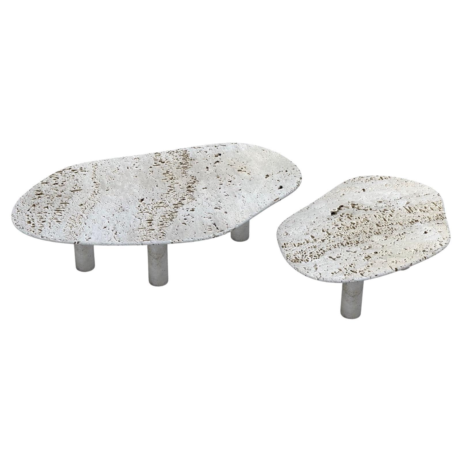An organic shaped nesting table made of Honed Travertine surface and matching solid travertine legs.

The larger table is 15