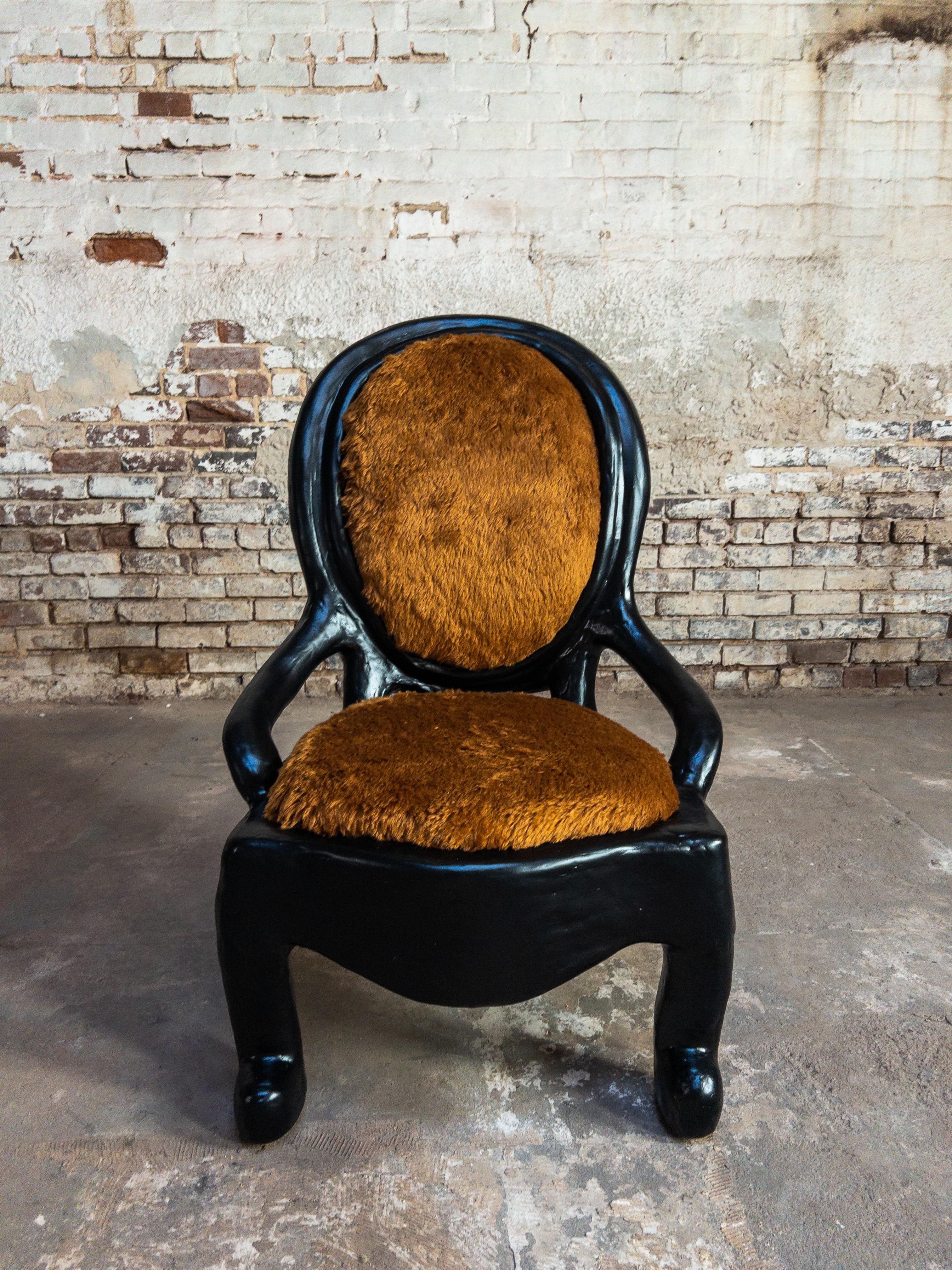 The Nestle Lounge Chair by Brent Warr merges playful form with sculptural elegance in a striking silhouette that commands attention. Its curved seat and exaggerated, tubular legs evoke a sense of softness and whimsy, while the substantial presence