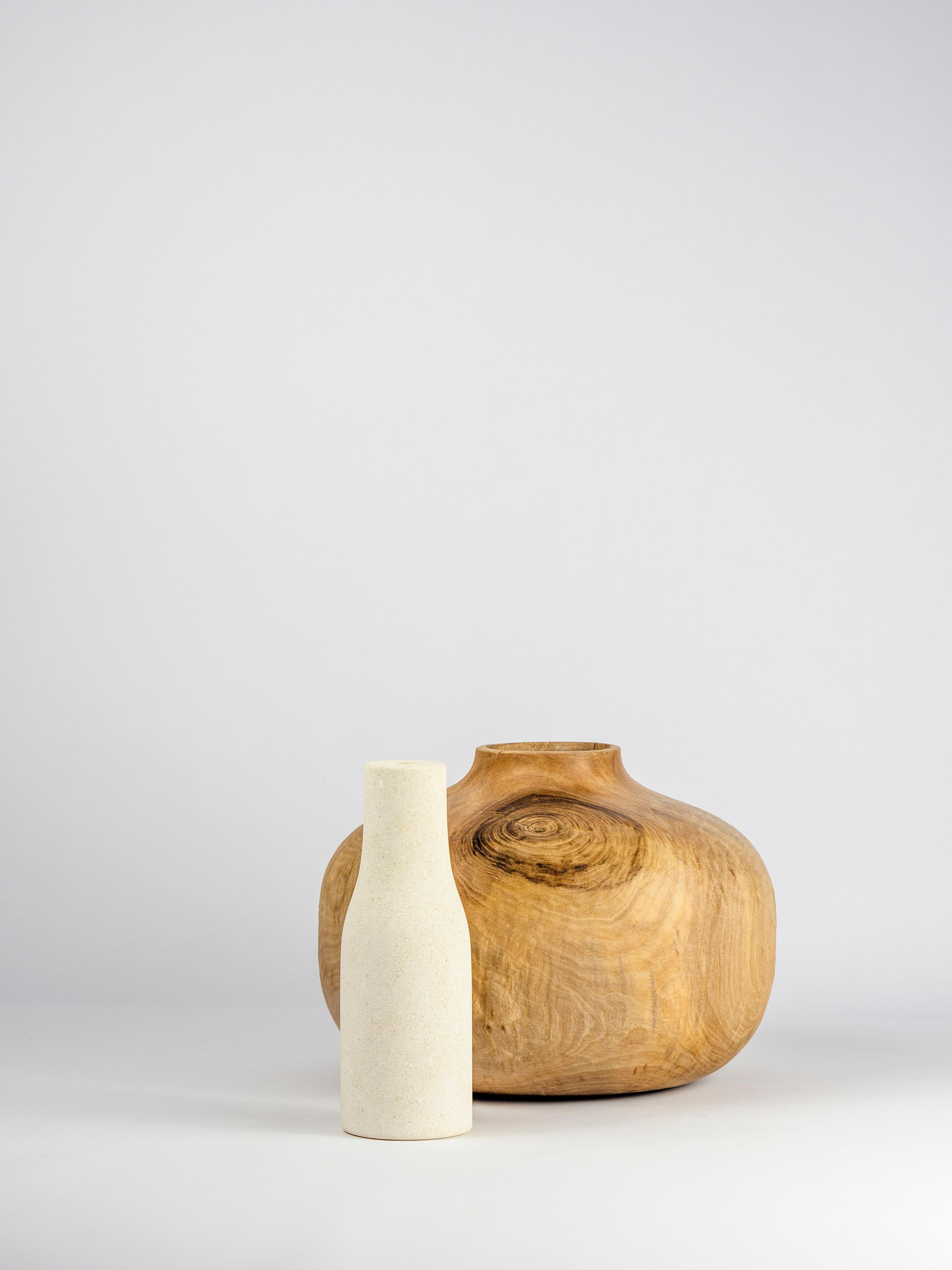 A collection of vases in Vicentina Stone and wood of Walnut, Beech, Alder and Chestnut that comes from the theme of the 