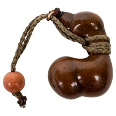 Nestuke in the form of a calabash gourd realised from an unmature cucurbitacea Nestuke in the form of a calabash gourd realised from an unmature cucurbitacea