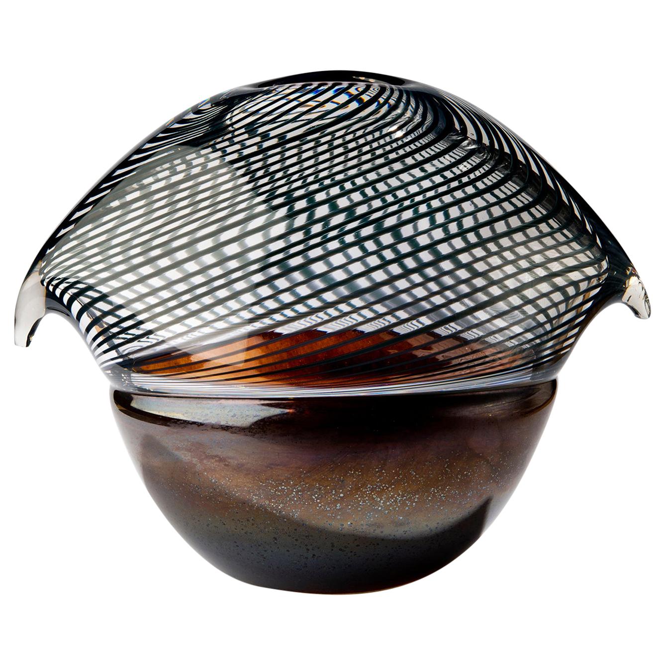 Glass object. Net Bird - Handblown copper glass and clear net glass attached.