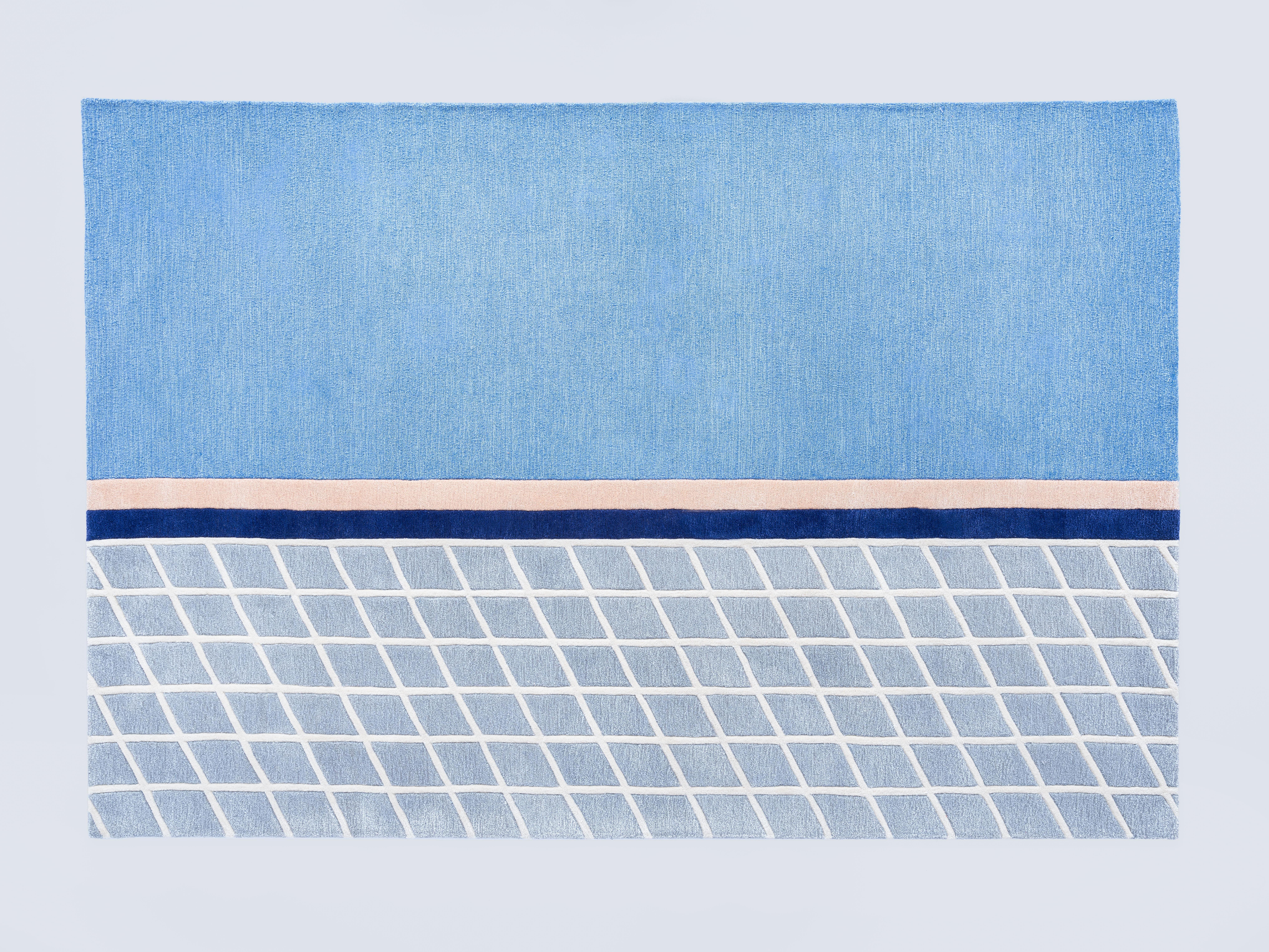 The “Court Series” rugs are hand tufted with blended wool and viscose material dyed in hyper-saturated colors, with tennis court-like geometries represented both via overlaid graphics as well as the cut and shape of individual segments.

Handmade
