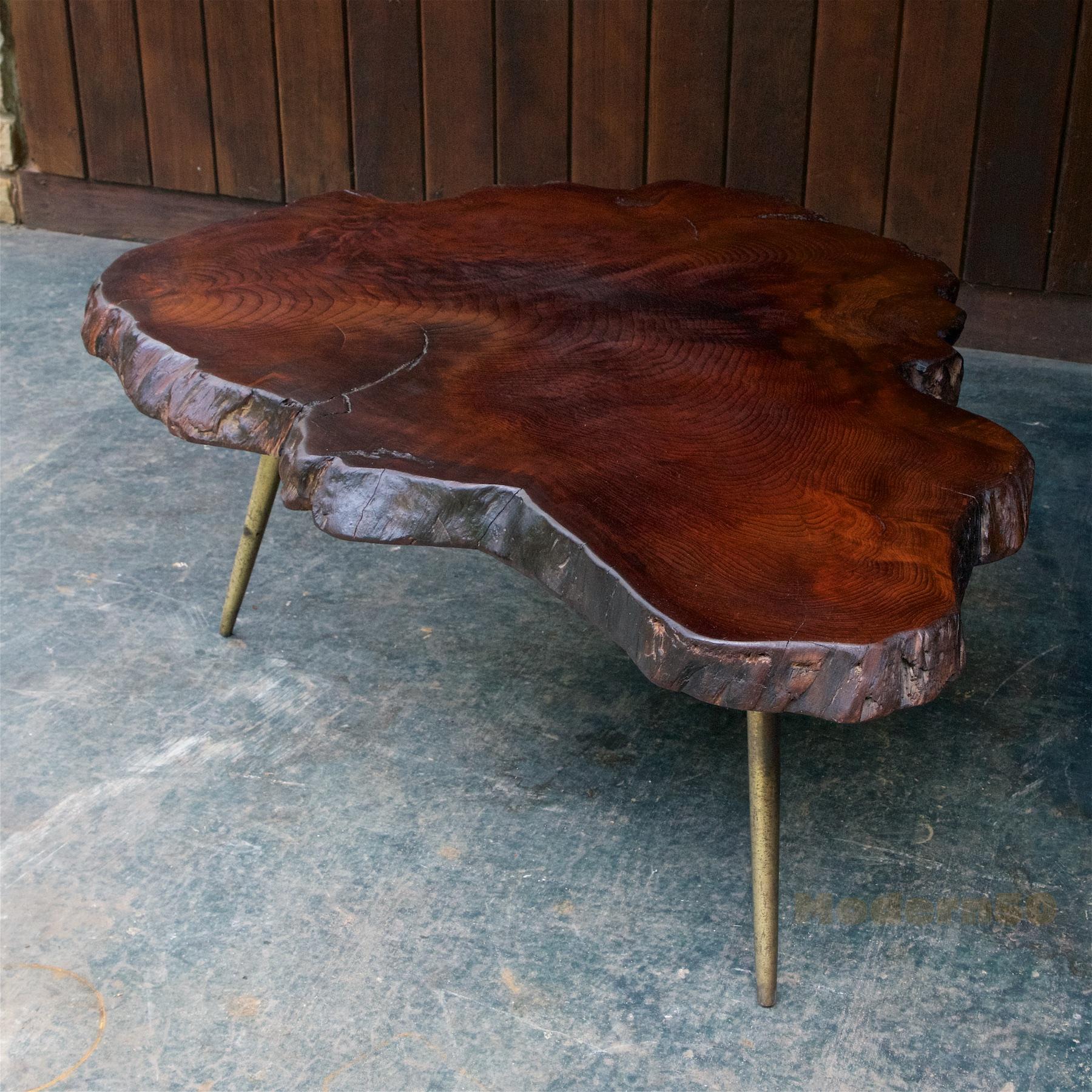 Rustic 3 inch thick triangular Myrtlewood tabletop on three heavily patinated brasstoned cast metal legs. Vintage Legs were newly applied and not original. Now a sturdy, strong and usable low table.