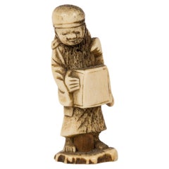 Netsuke in deer antler in the form of a feminine figure in traditionnal clothing Netsuke in deer antler in the form of a feminine figure in traditionnal clothing