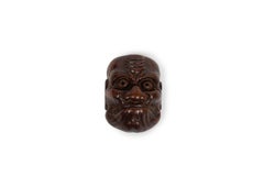 Netsuke in the form of a No mask representing the character of Hyottoko