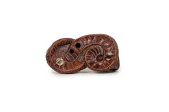 Netsuke in the form of a snake in boxwood with inlaid eyes and signature