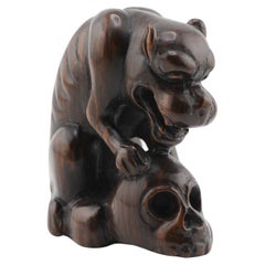 Netsuke Japanese Dog Eating Skull Sculpture, 20th Century