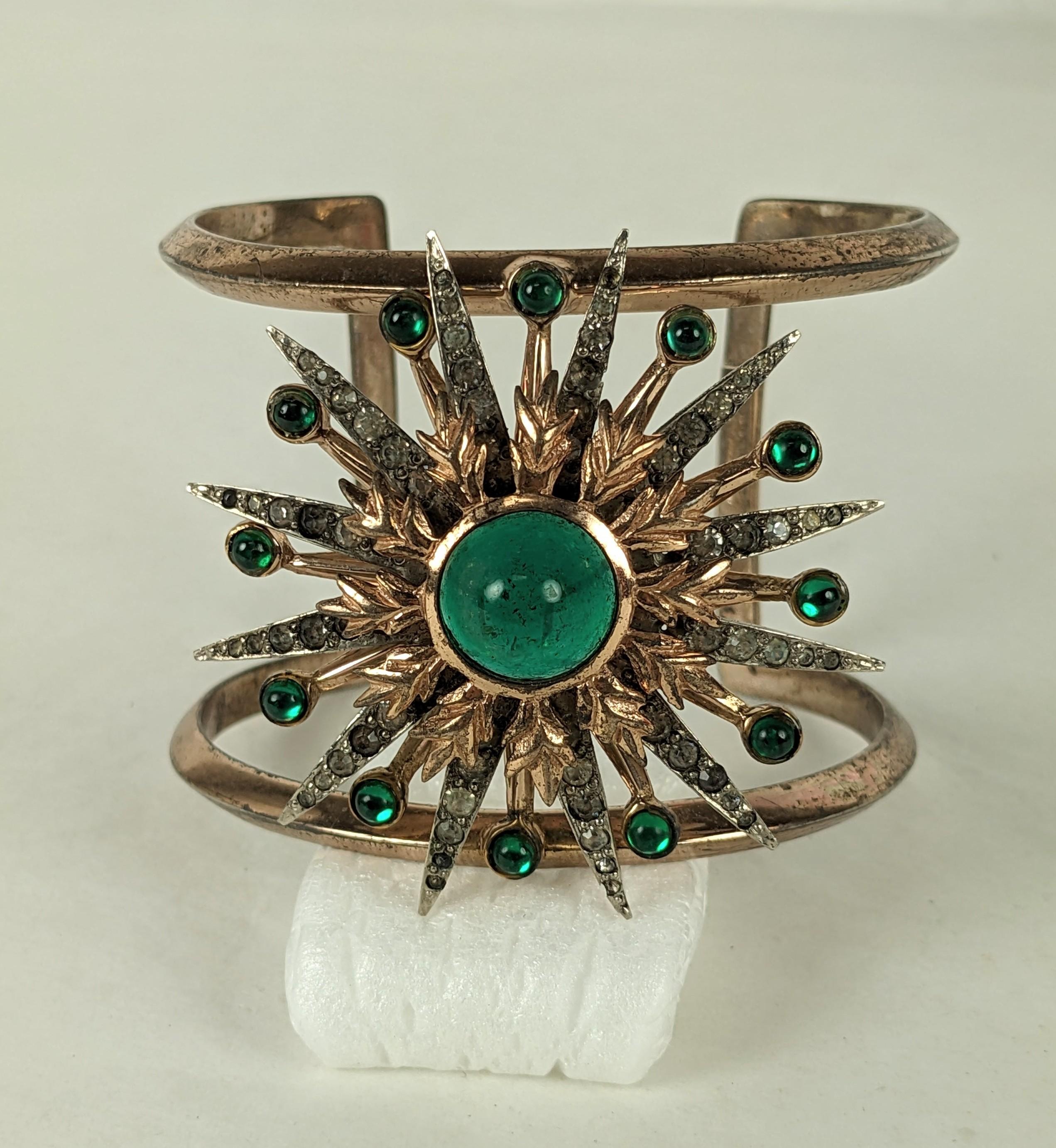 Striking Nettie Rosenstein Starburst Cuff in sterling with pink gold vermeil from the 1940's. Large starburst motif in emerald and crystal pastes. 2
