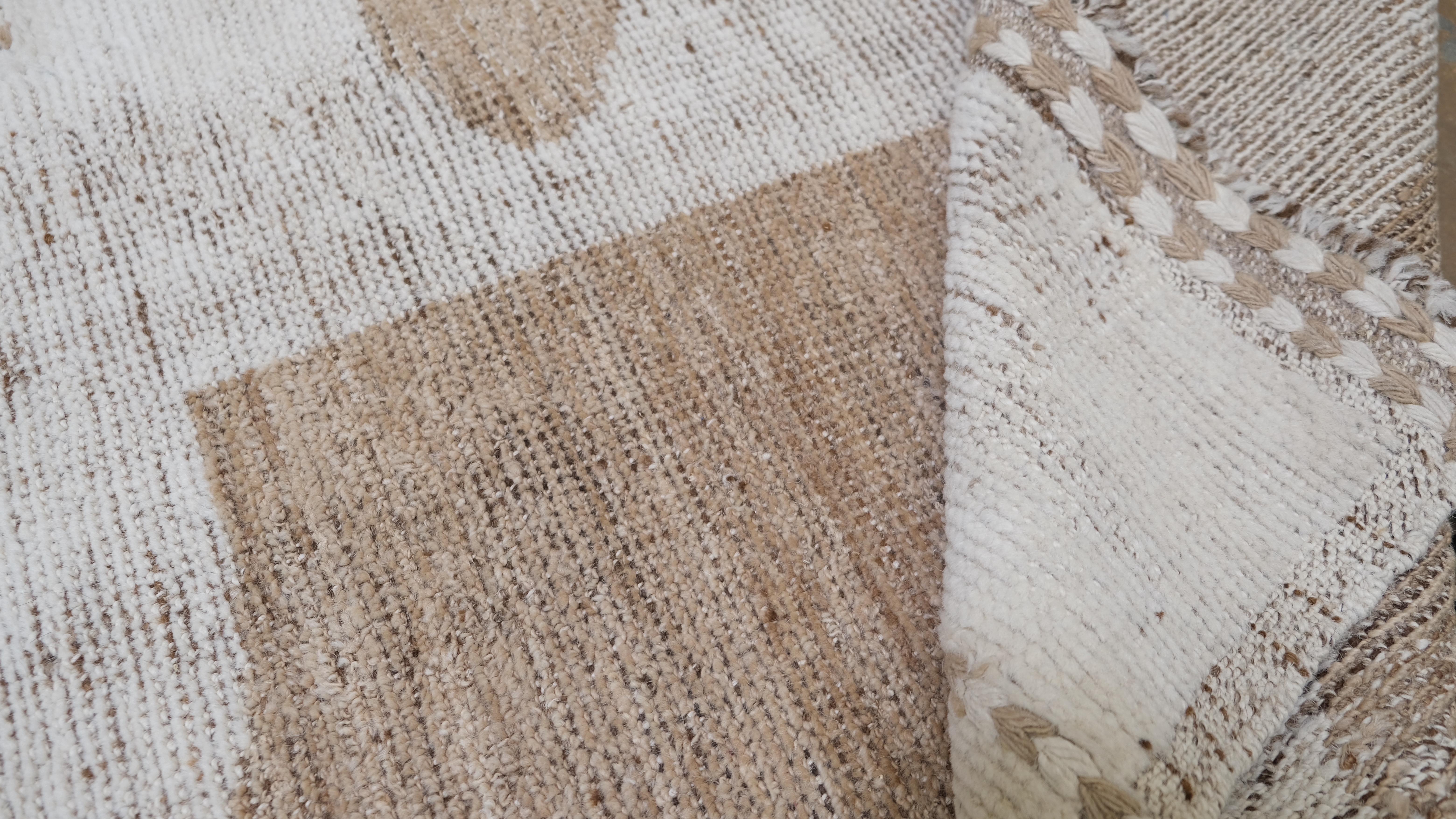 Elevate your interior space with this exquisite hand-knotted wool runner rug, featuring a bold and unique geometric half-moon design in a natural brown and taupe color palette. The minimalist yet artistic pattern adds a modern aesthetic while