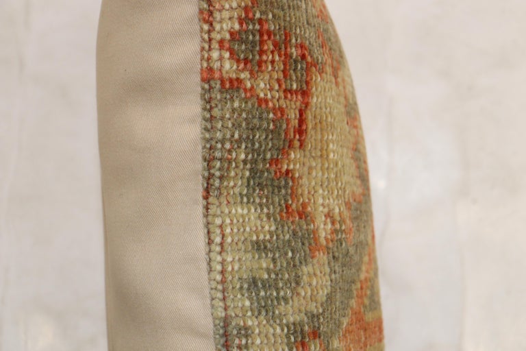 Pillow made from a Turkish Oushak rug. Tan brown and green accents.

Measures: 11