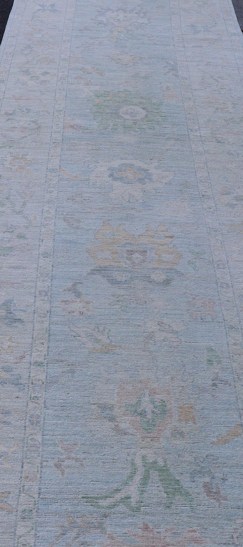Neutral Color Gallery Oushak Runner with Medallion Design in Light Blue Field. Keivan Woven Arts; rug AWR-17798 Country of Origin: Afghanistan Type: Oushak Design: Medallion, Motif, Floral Motif. 
Measures: 4'2 x 18'2 
This modern piece holds