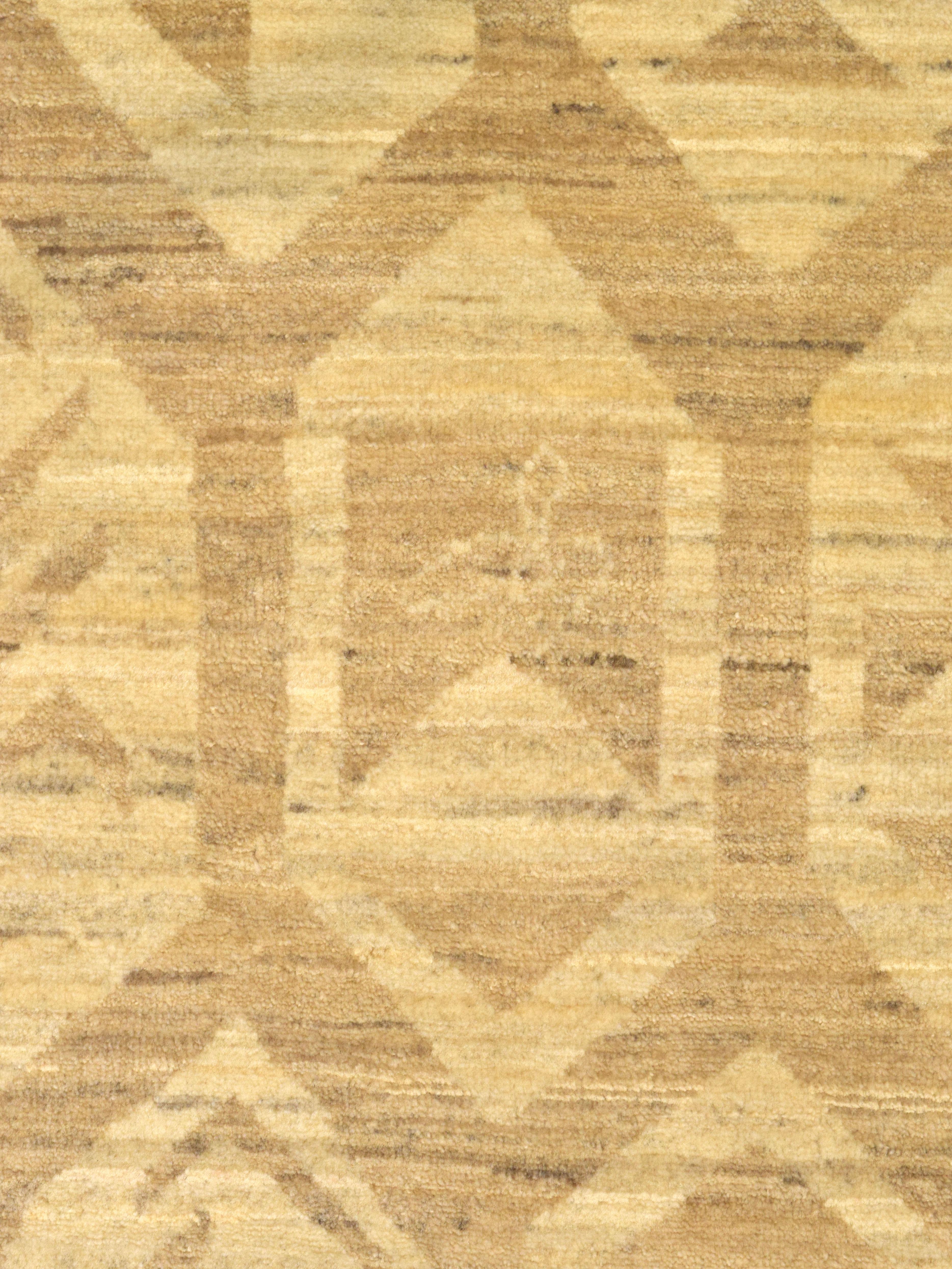 A quietly refined modern 4′ × 6′ hand-knotted wool Persian rug in warm golden/camel tones with a subtle, low-contrast geometric lattice. The tonal pattern reads as texture from a distance and resolves into soft octagonal motifs up close which is