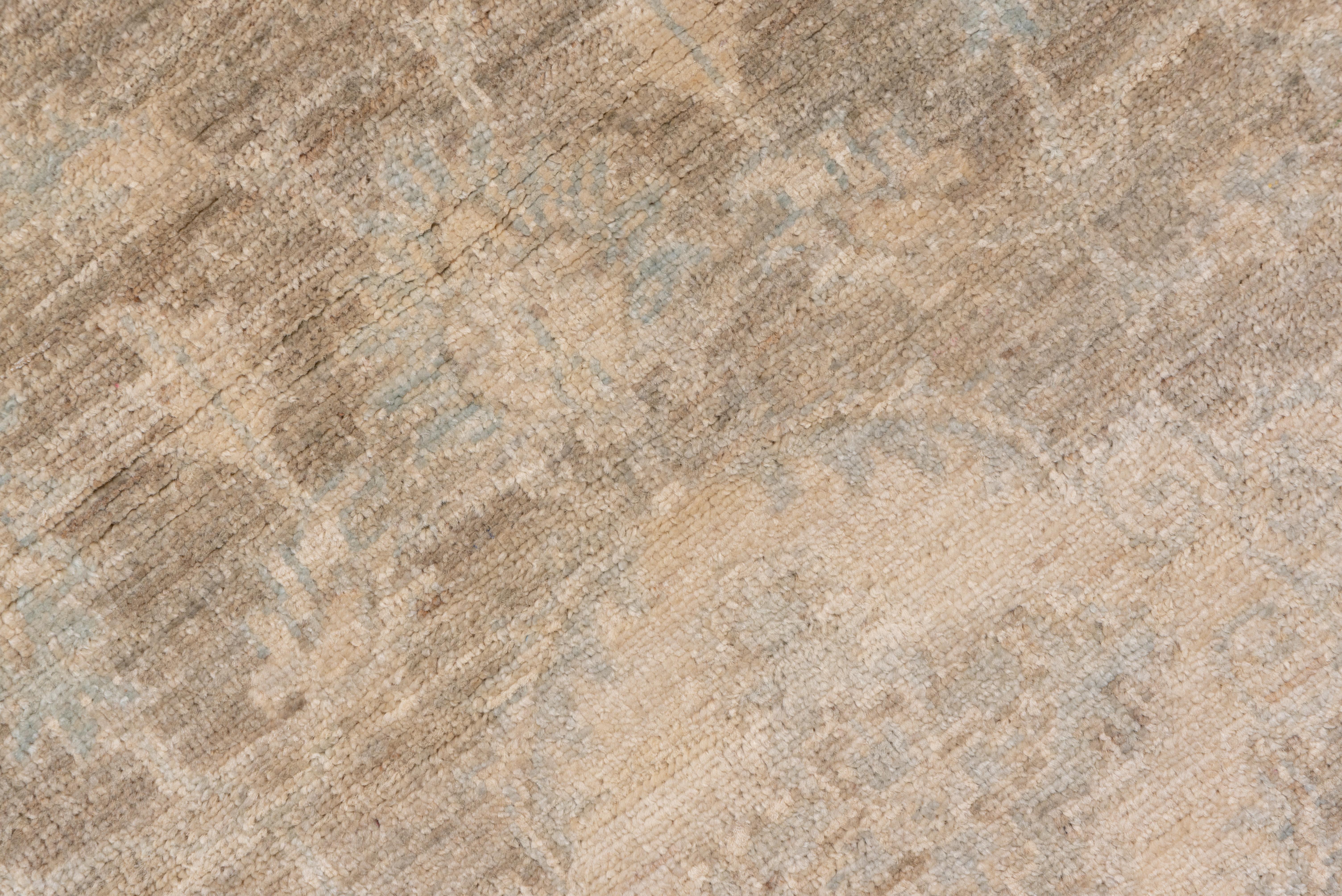 The cartouche medallions are supported by curling arabesques decorated with small palmettes on the abrashed light brown field of this town runner. Straw features in the medallions.