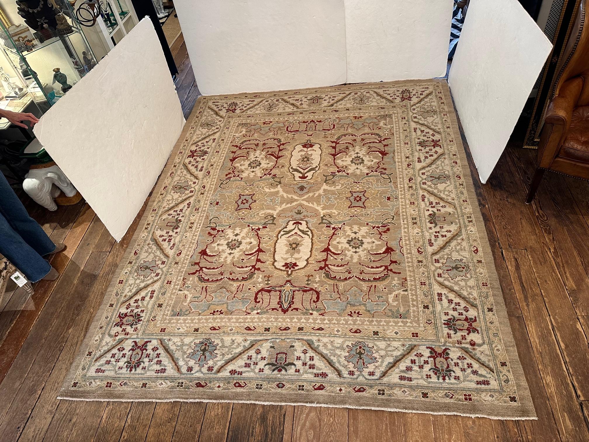 Contemporary, 8' x 10' Sultanabad style wool area rug from Turkey in muted shades of beige, cream, blue, and rusty red. Great condition, low pile.

Gayle 