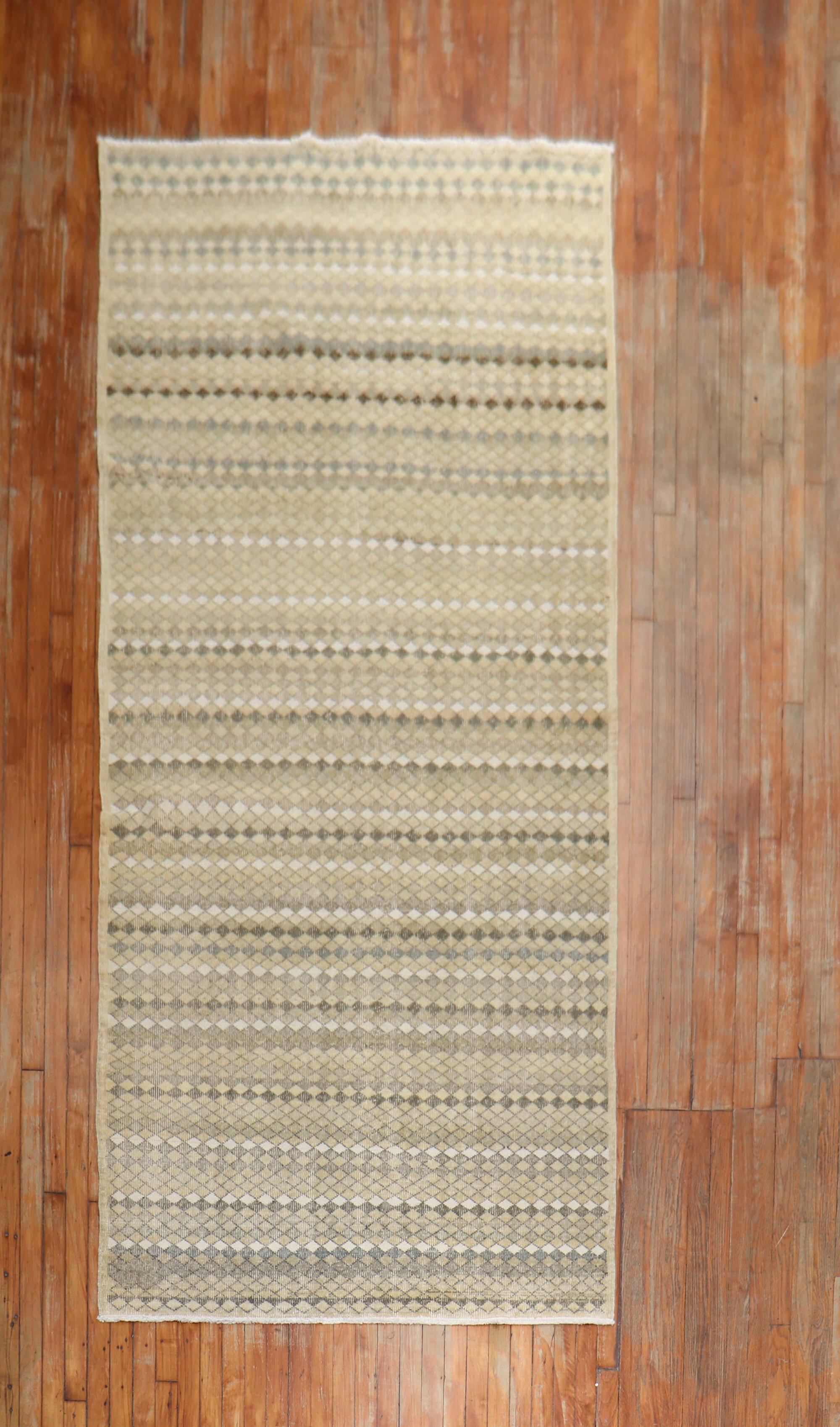 Neutral color vintage one of a kind wide Turkish Deco gallery runner with an all-over diamond motif A chic piece, circa mid-20th century.

Measures: 4'5” x 11'4”.
