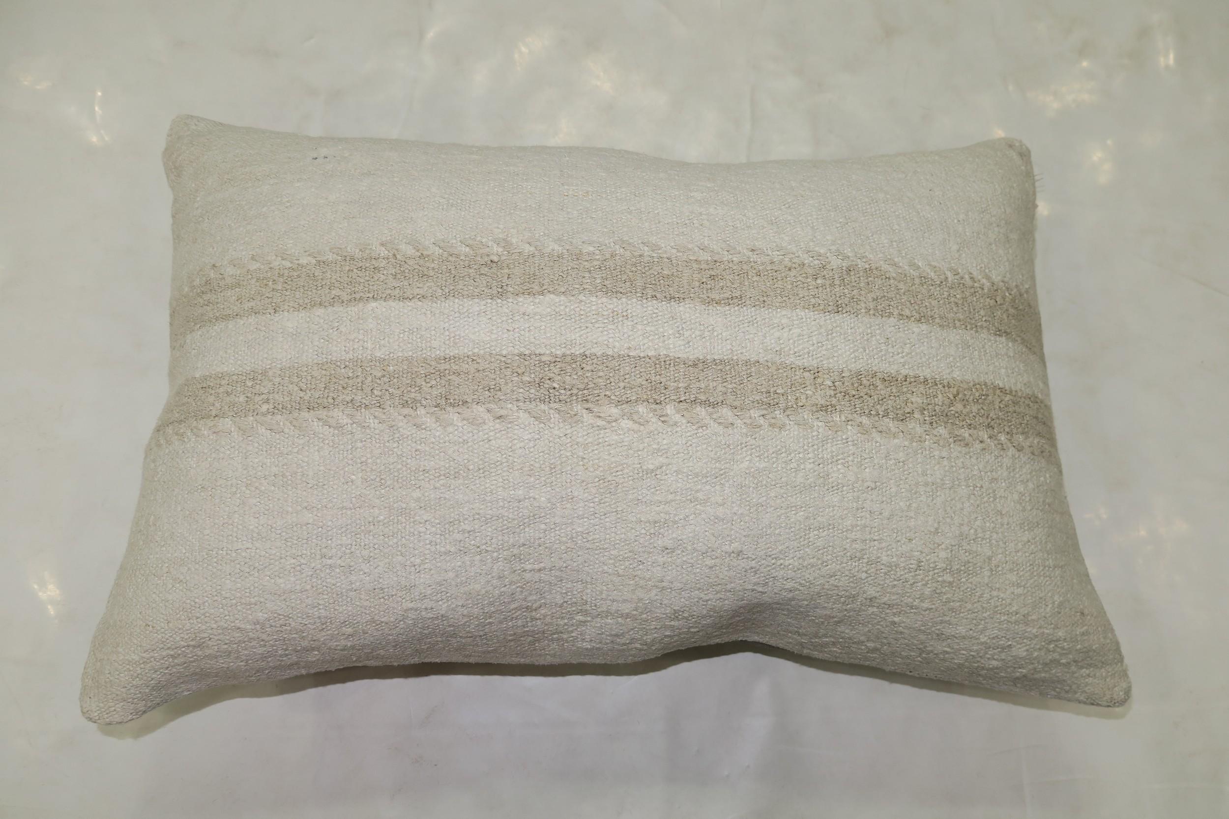 Pillow made from modern Turkish Kilim in white and gray

Measures: 15'' x 23''.