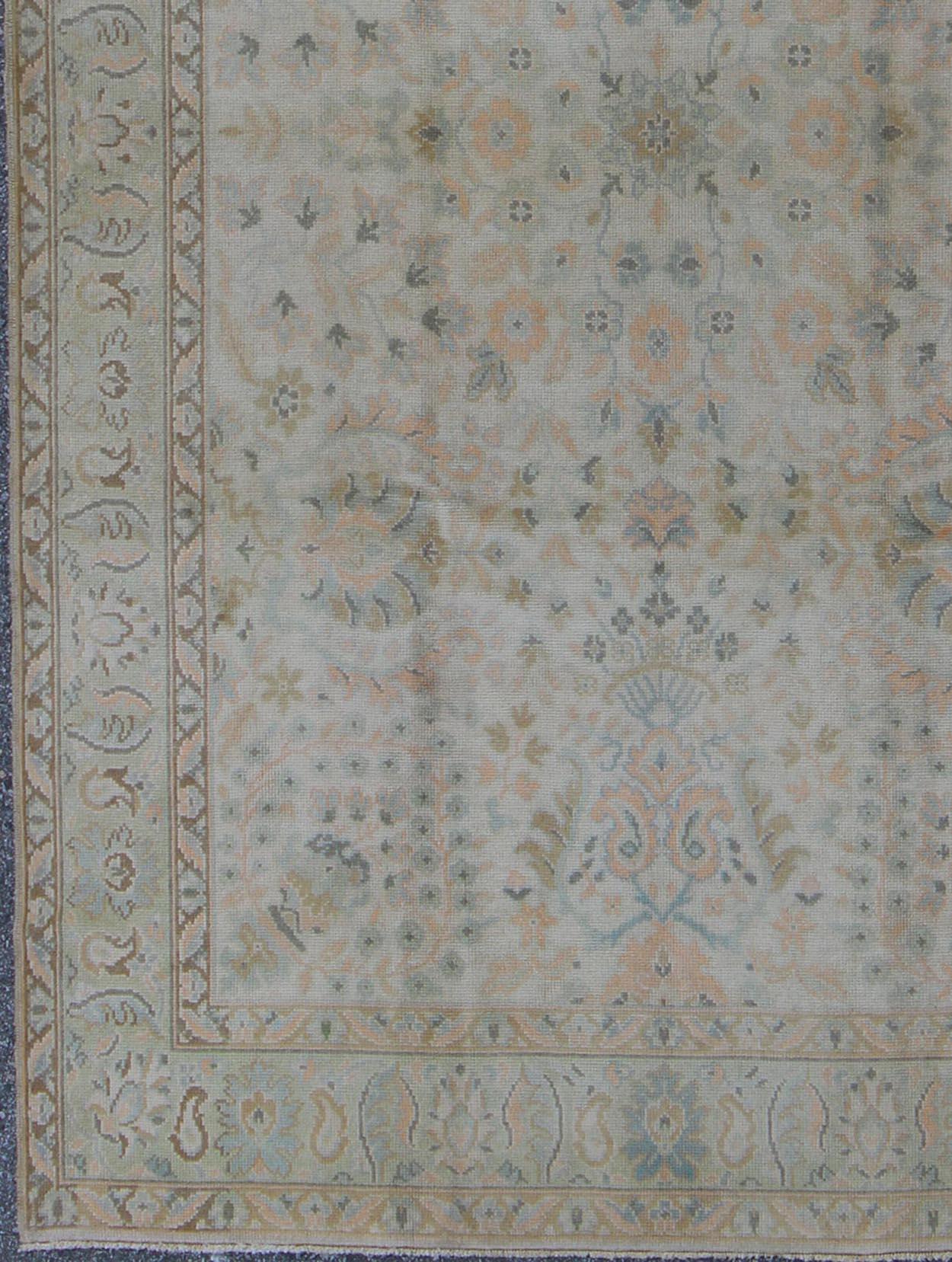 Hand-Knotted Neutral Vintage Turkish Oushak Rug with Floral Design and Repeated Floral Motifs For Sale
